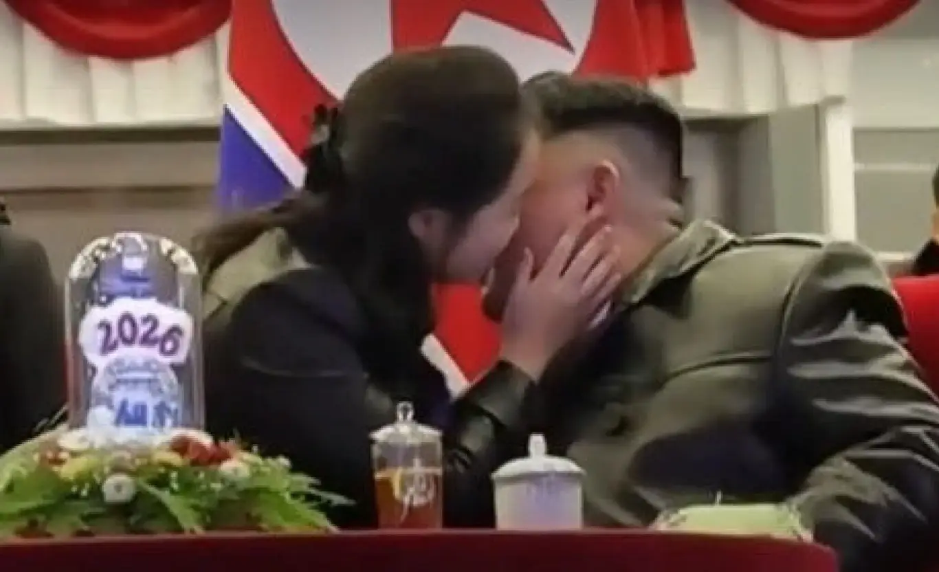 Kim Ju-ae gave her dad a kiss on the cheek at a New Year's celebration this year (Korean Central Television)