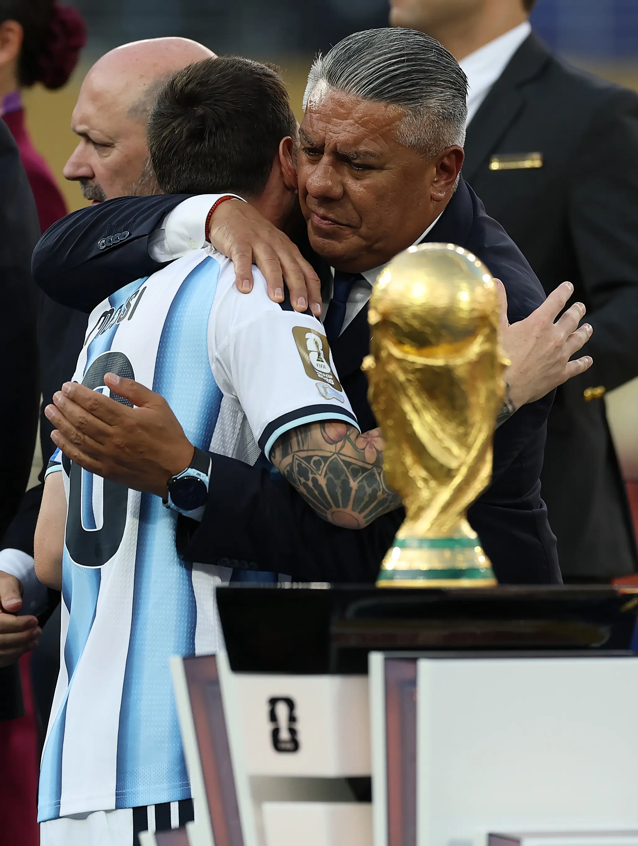 Tapia seen embracing Lionel Messi after being defeated by Spain on Sunday (Ian MacNicol/Getty Images)