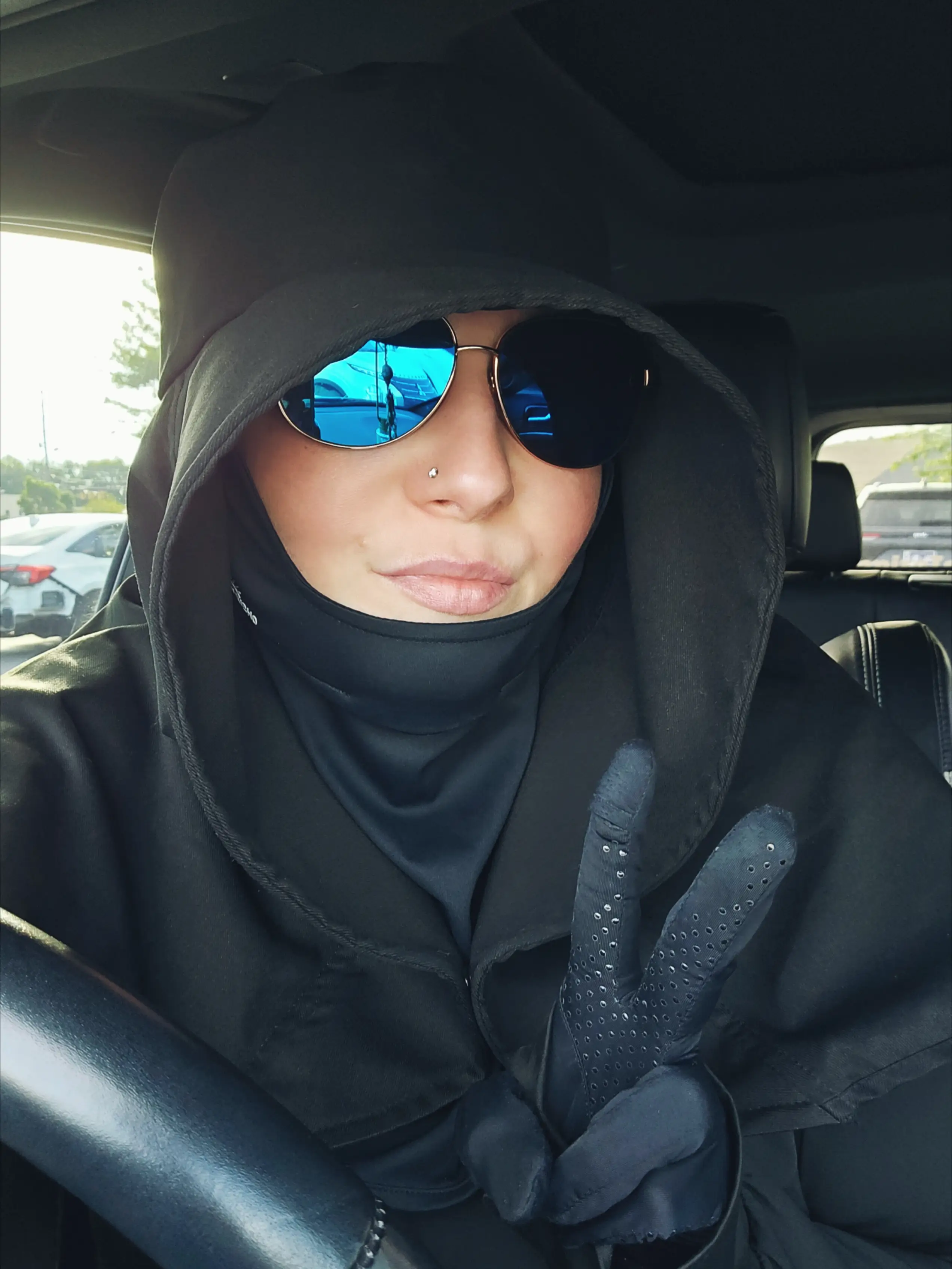 Emily has to wear full UV protection to leave the house (Supplied/Emily Richardson)