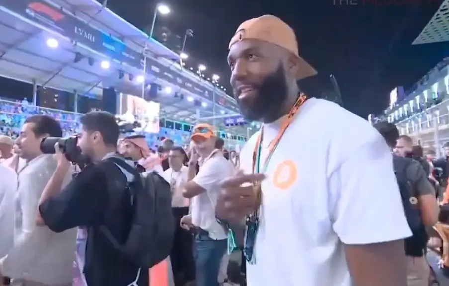 The former NFL star was seen pointing at the Bitcoin logo on his t-shirt after Brundle cut him off (Sky Sports)
