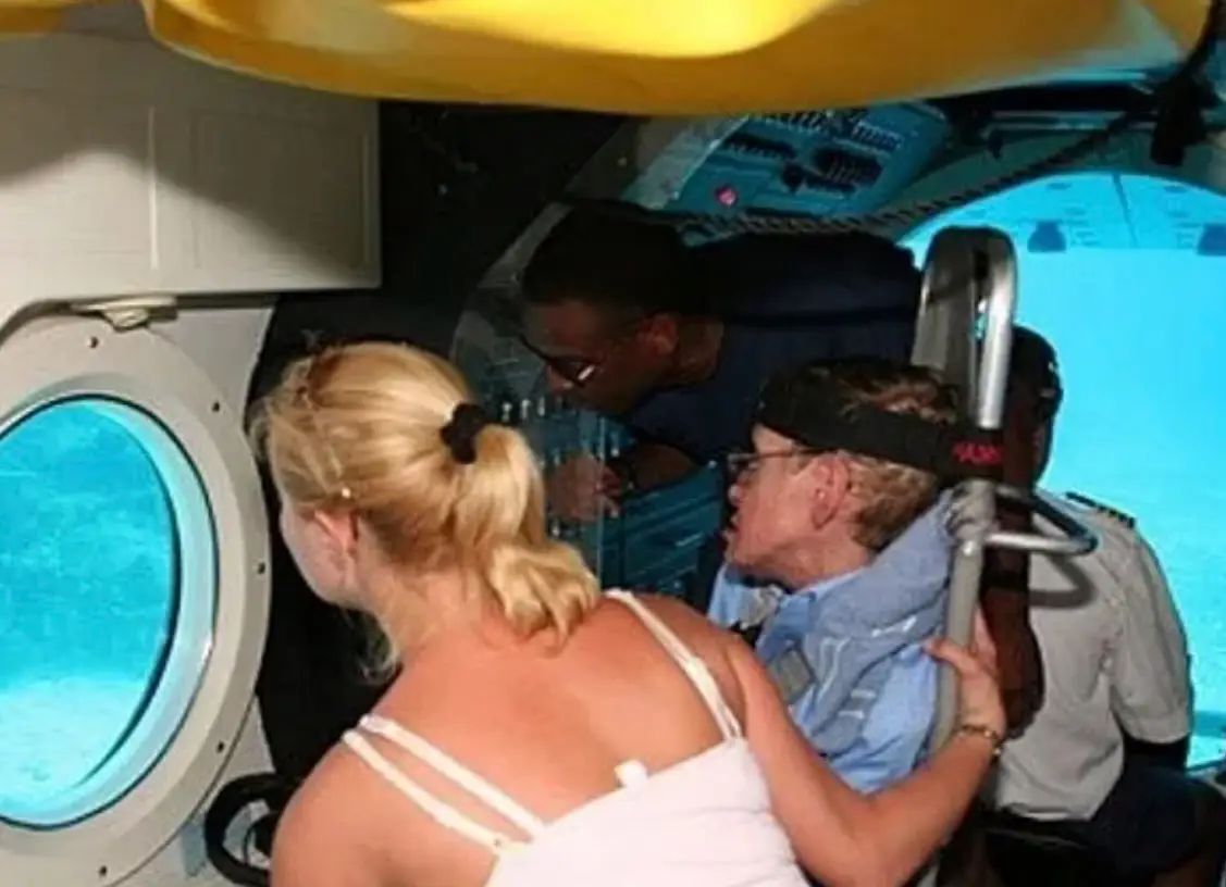 The world renowned astrophysicist seen enjoying an underwater tour at Epstein's island (US Department of Justice)