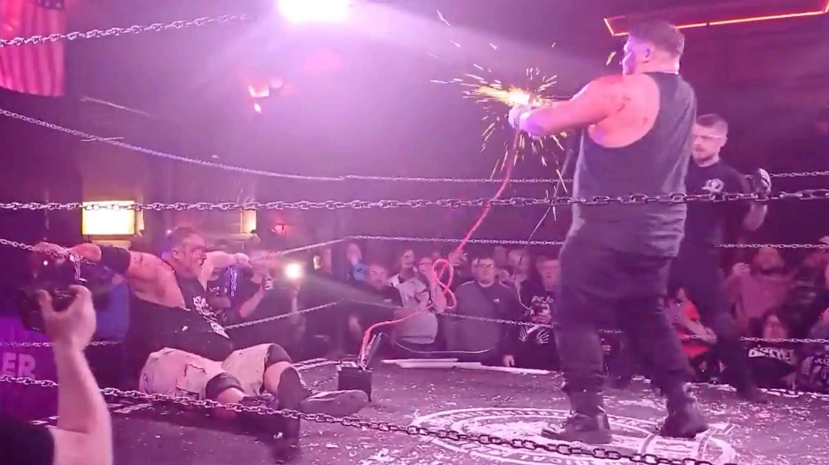 Sparks flew from the jump leads before Isaac appeared to start convulsing (X/@BritWresAwayDay)