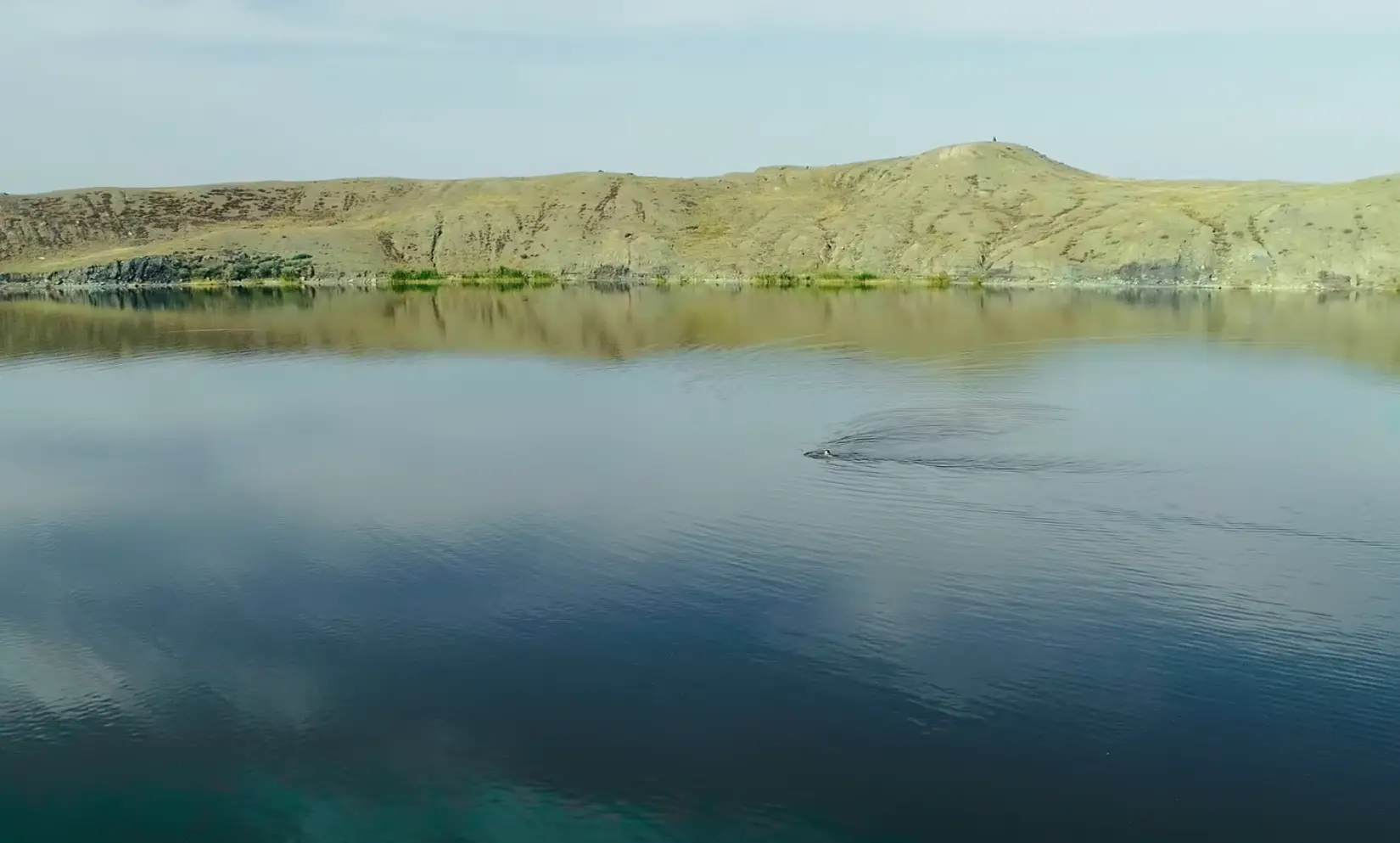 The lake is still radioactive decades after the area stopped being a nuclear testing site, but people fish and swim in it (Netflix) 
