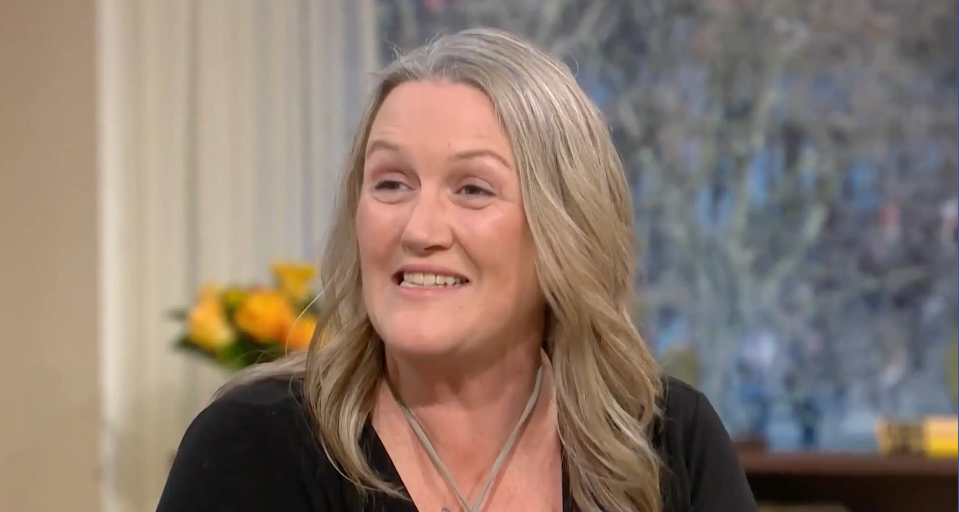 The mum explained how she ended up suspended upside down with her full chest on display.