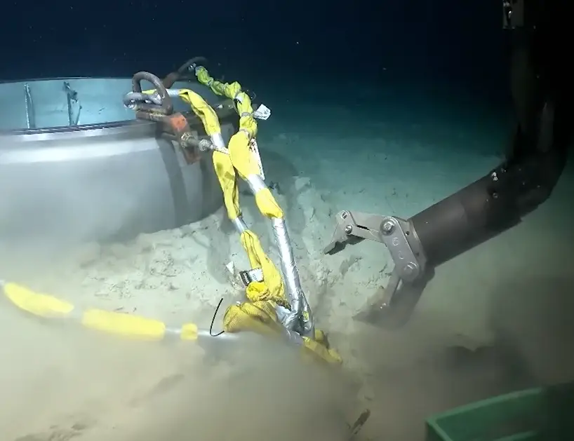 The US Coast Guard has shared a clip showing the moment a robot salvages what's left of the Titan sub (US Coast Guard)