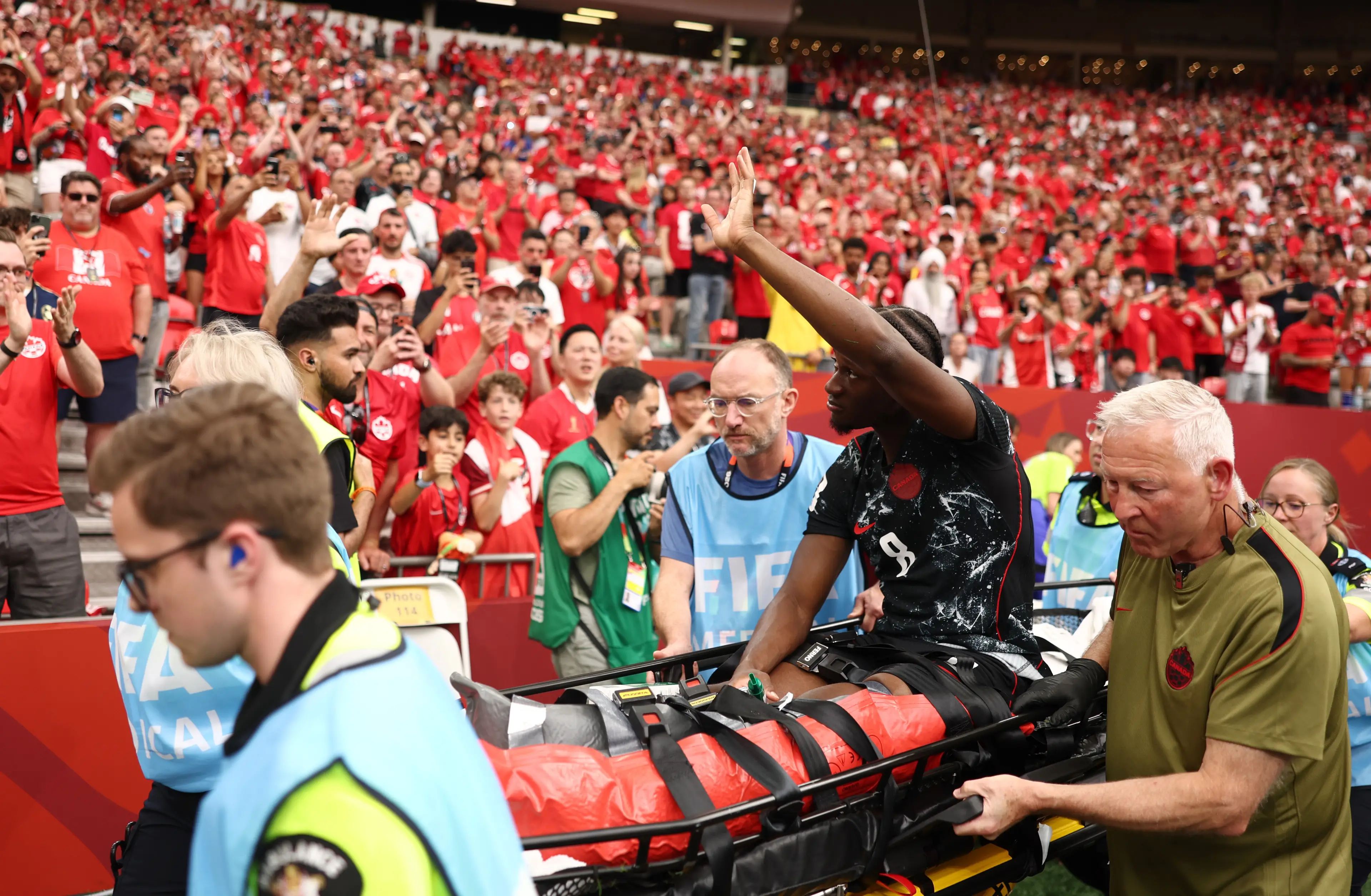 Ismael Kone waved to fans as he was stretchered off. (Fran Santiago/Getty Images)