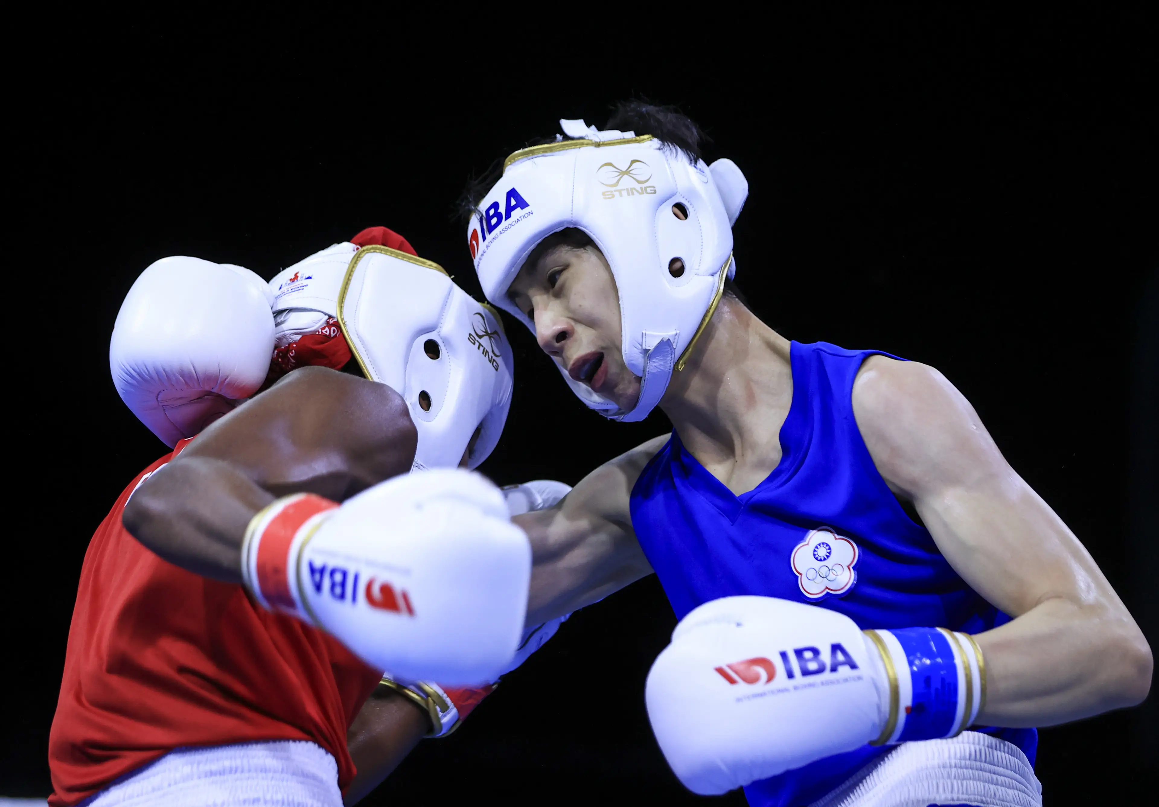 Lin Yu-ting (wearing blue) competing in the World Boxing Championships in 2022, where she won featherweight gold and would be stripped of a bronze the following year. (Mehmet Eser/Anadolu Agency via Getty Images)