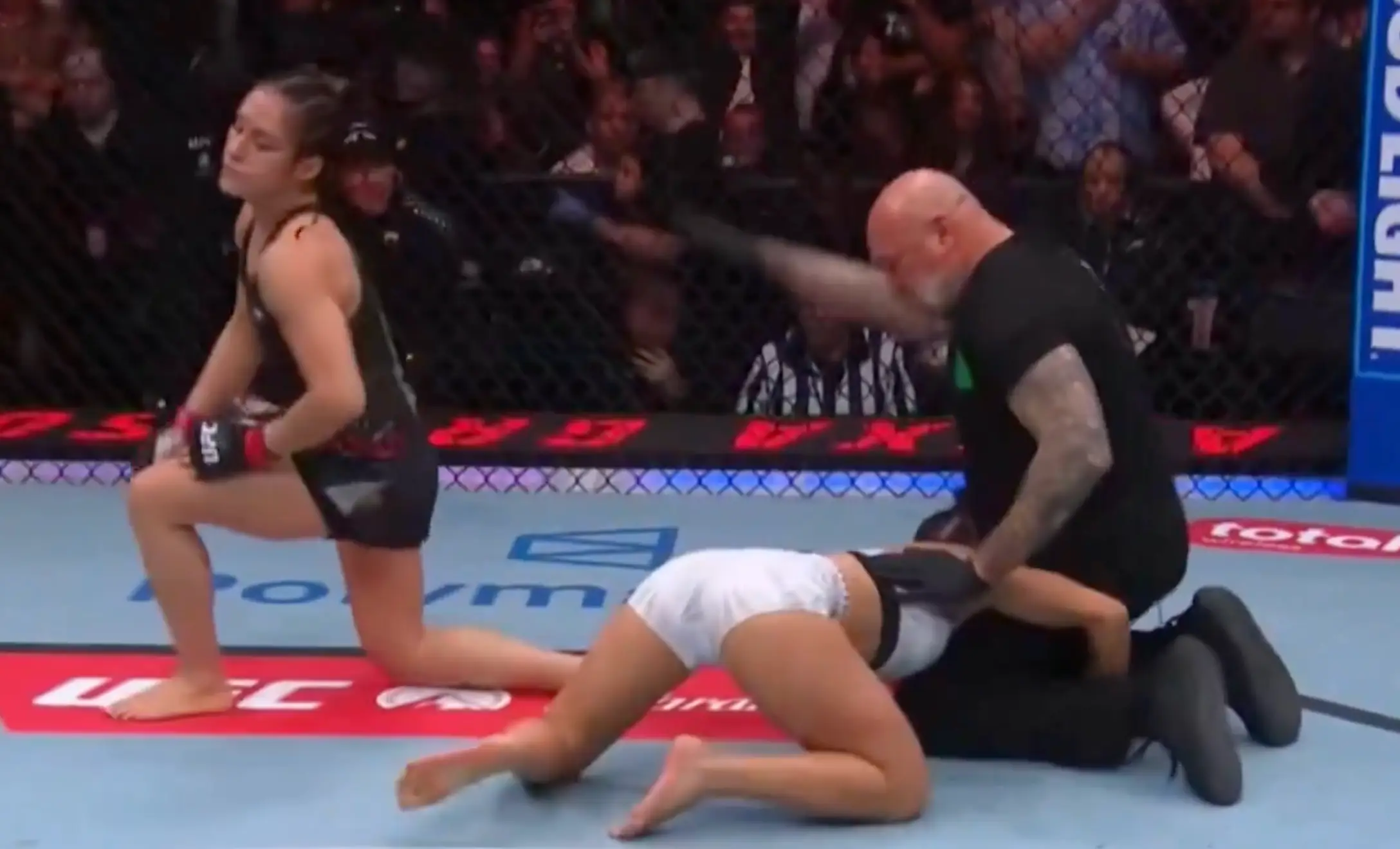 Barber was desperately grabbing the referee's legs after the knockout (Paramount Plus)