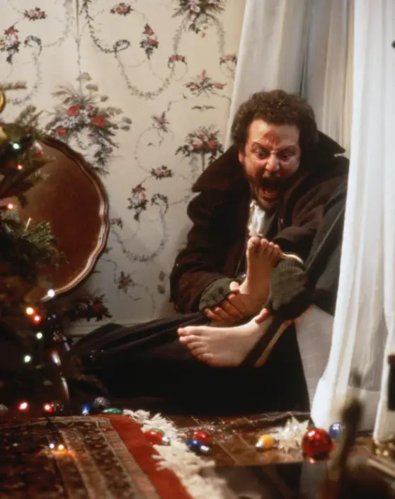 Standing on glass baubles after taking an iron to the face were just two of the prank Marv was subjected to by Kevin (20th Century Fox)