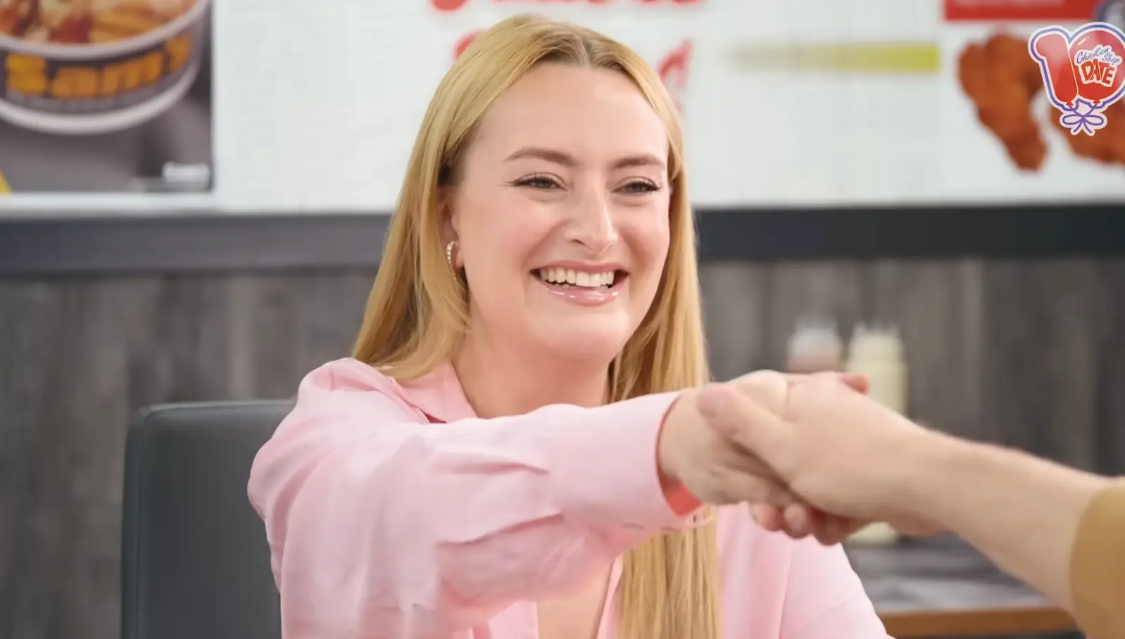 Ameila shakes hands with Andrew Garfield (YouTube/Amelia Dimoldenberg)
