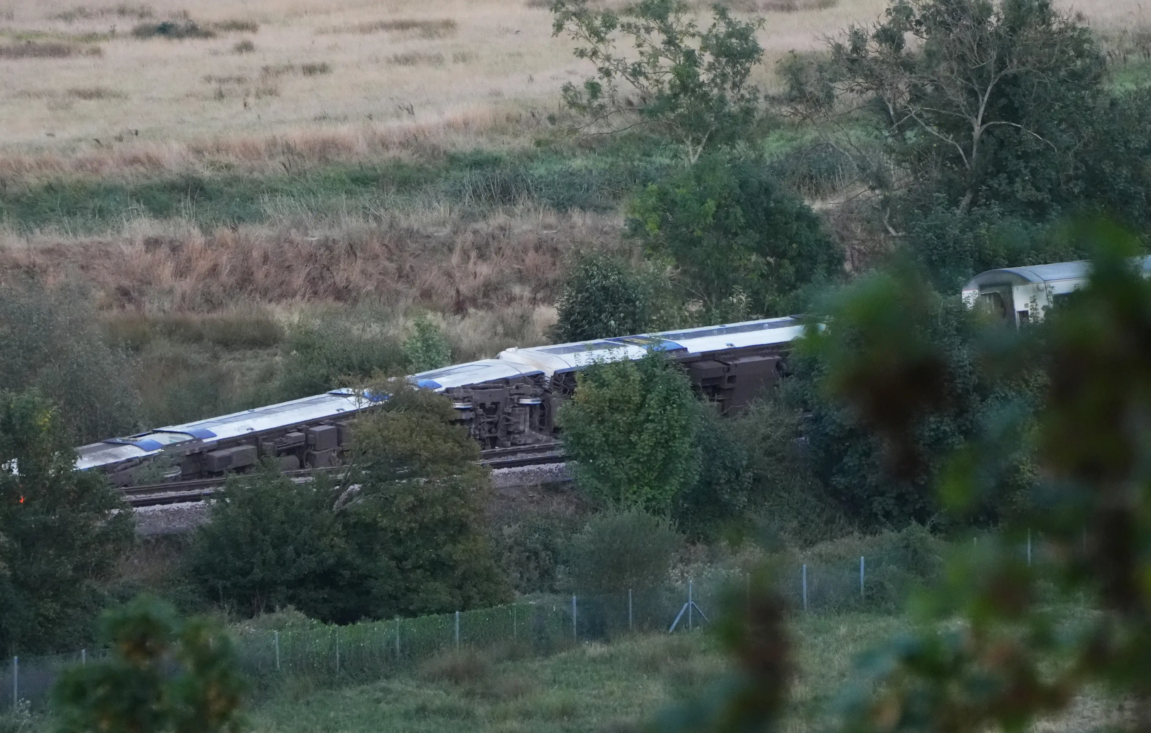 The overturned carriages (Jonathan Brady/PA Wire)