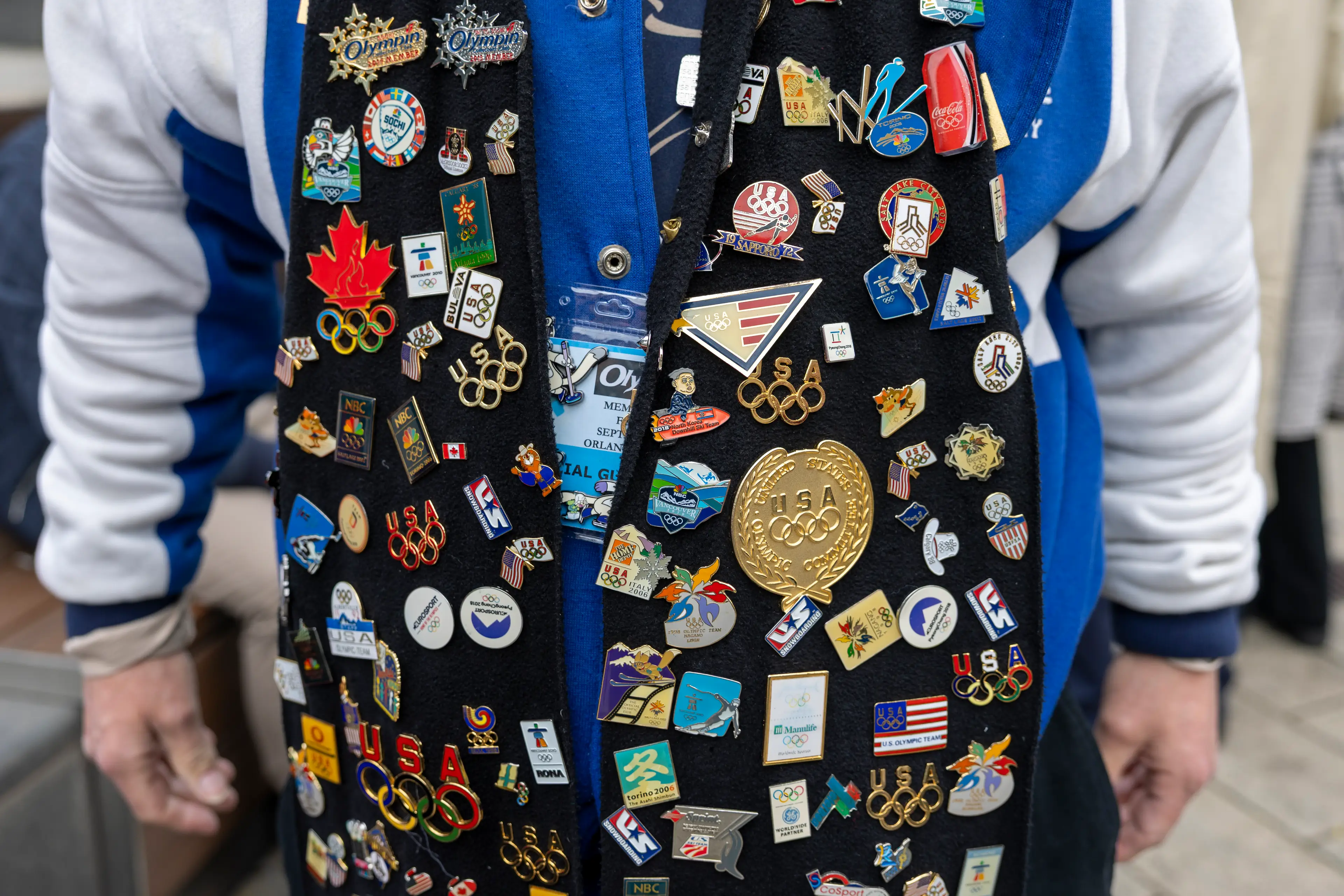 A pin trader shows off his haul in Milan (Maja Hitij/Getty) 