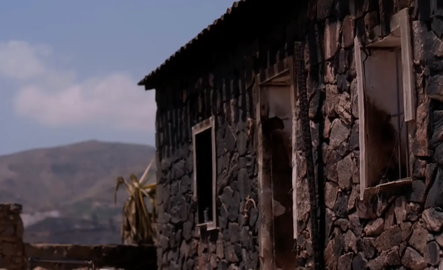 The burnt out remains of Malcolm and Annette's home (BBC News)