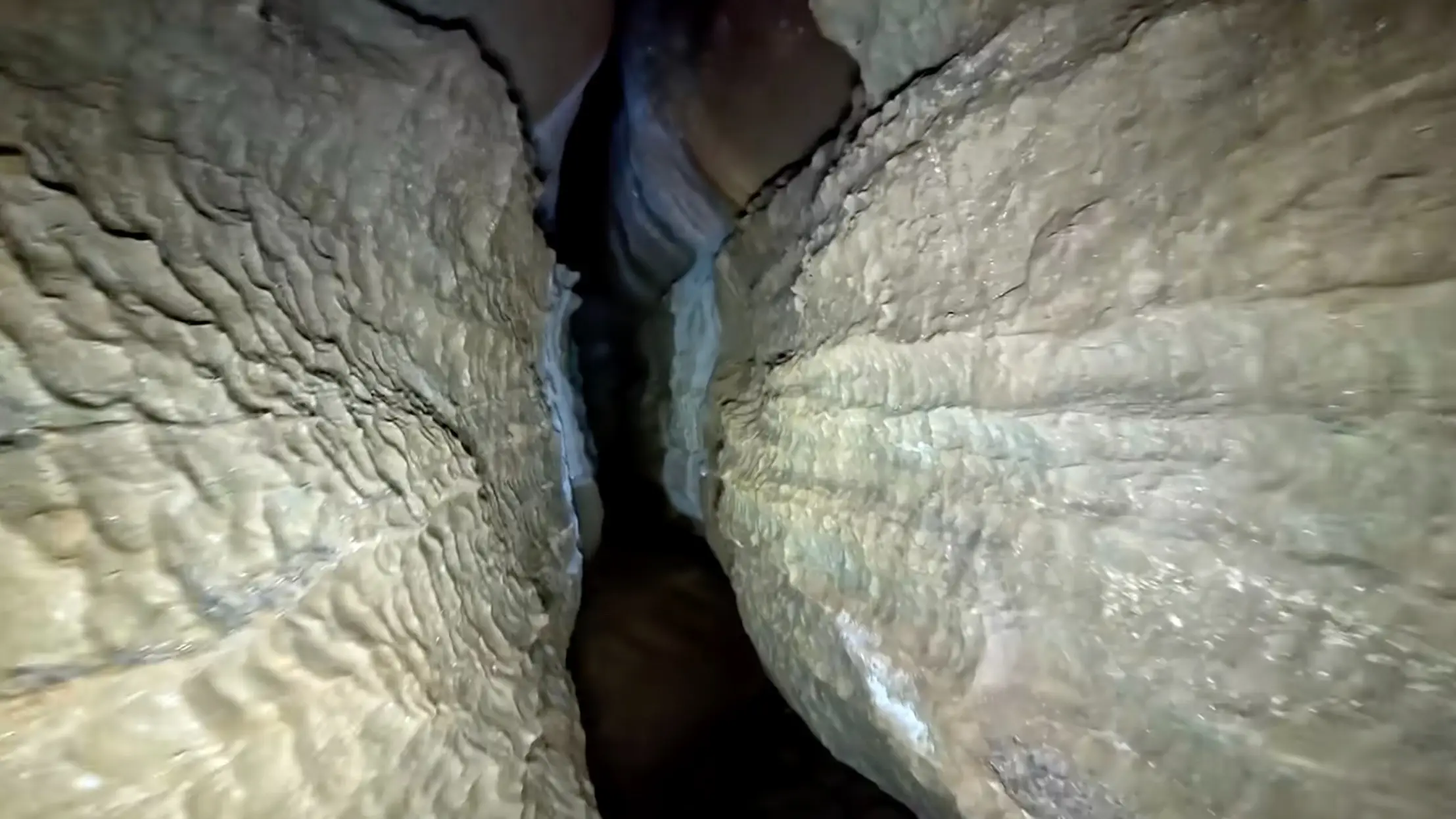 Underground cave explorer stops in his tracks and leaves after spotting something on the walls