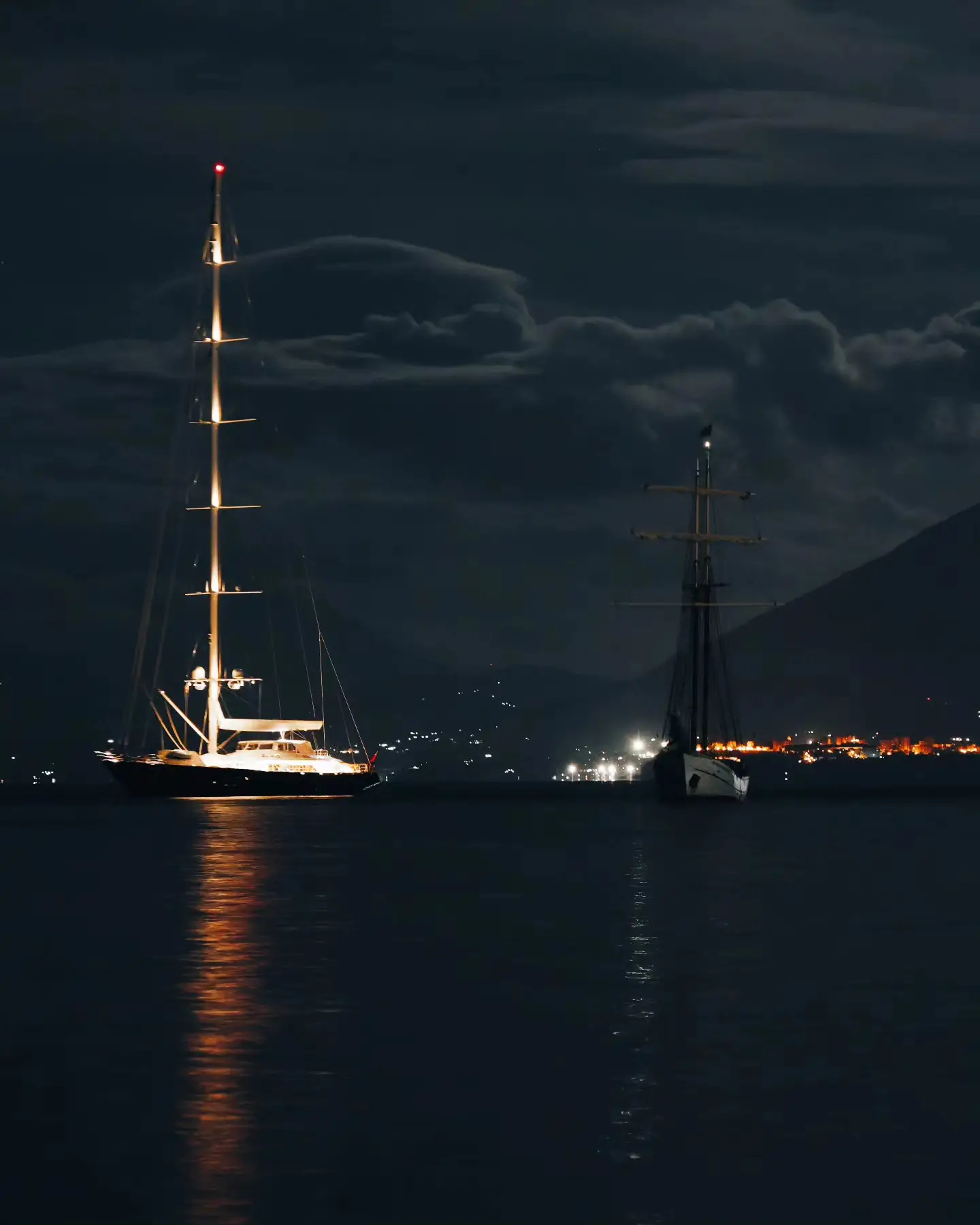 The Bayesian (left), which capsized and sunk off the coast of Sicily in bad weather. (Fabio La Bianca/PA)