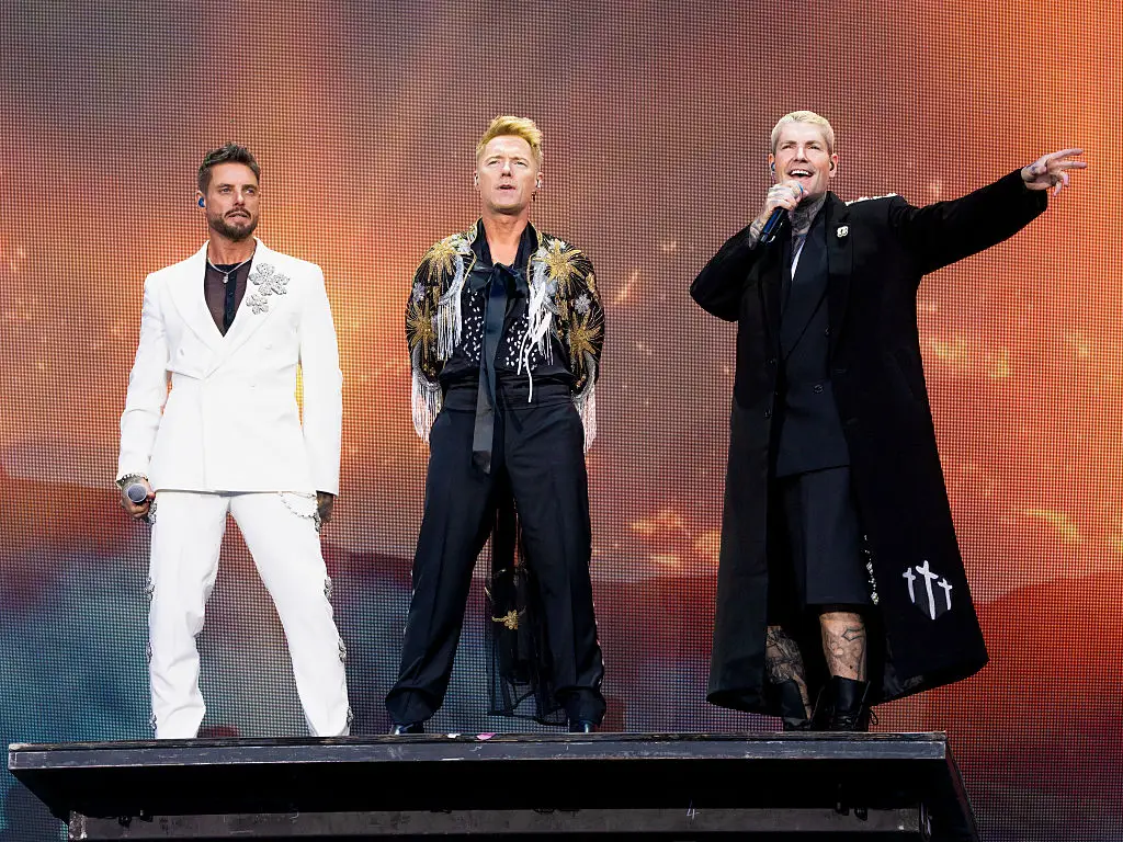 When Boyzone stepped onto the stage fans were worried Mikey Graham wasn't with them, though he joined them later (James Klug/Getty Images)