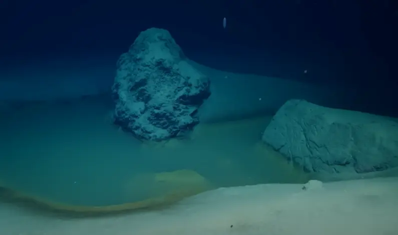 They may not look like much, but these brine pools could tell us a lot about finding hospitable planets (YouTube/OceanX)