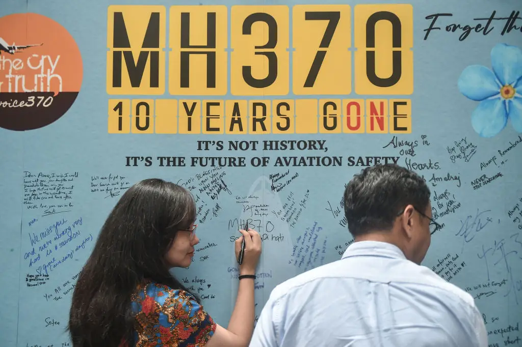 Relatives of MH370 passengers commemorate their missing loved ones. (ARIF KARTONO/AFP via Getty Images)