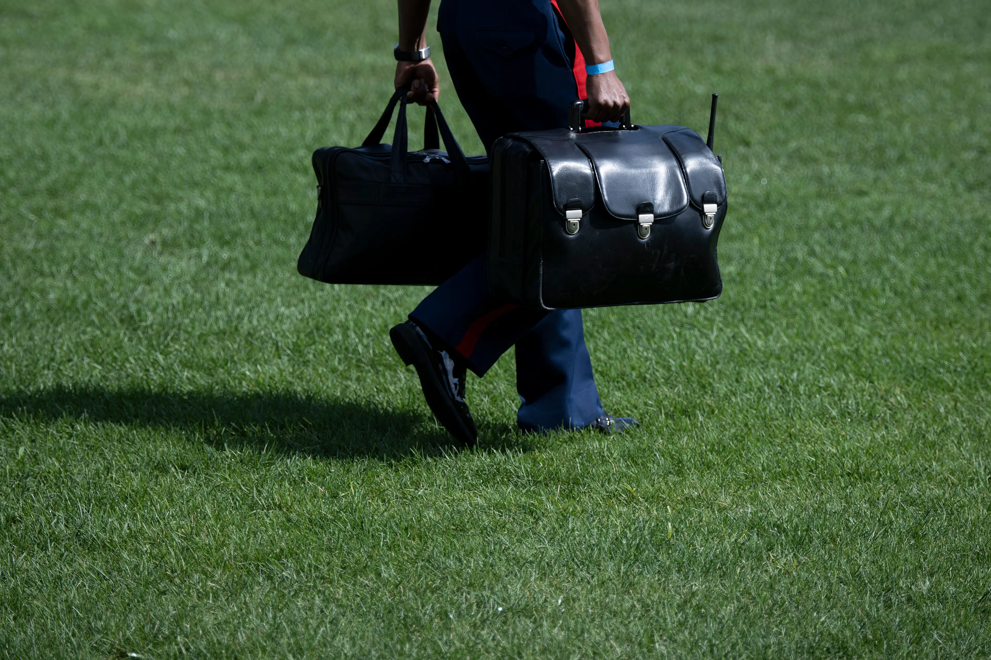 The 'nuclear football' appears to have a little antenna coming out of it (BRENDAN SMIALOWSKI/AFP via Getty Images)