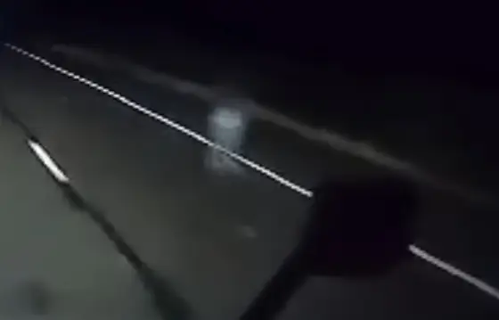 People think they can see a pair of ghostly legs trudging down the road.