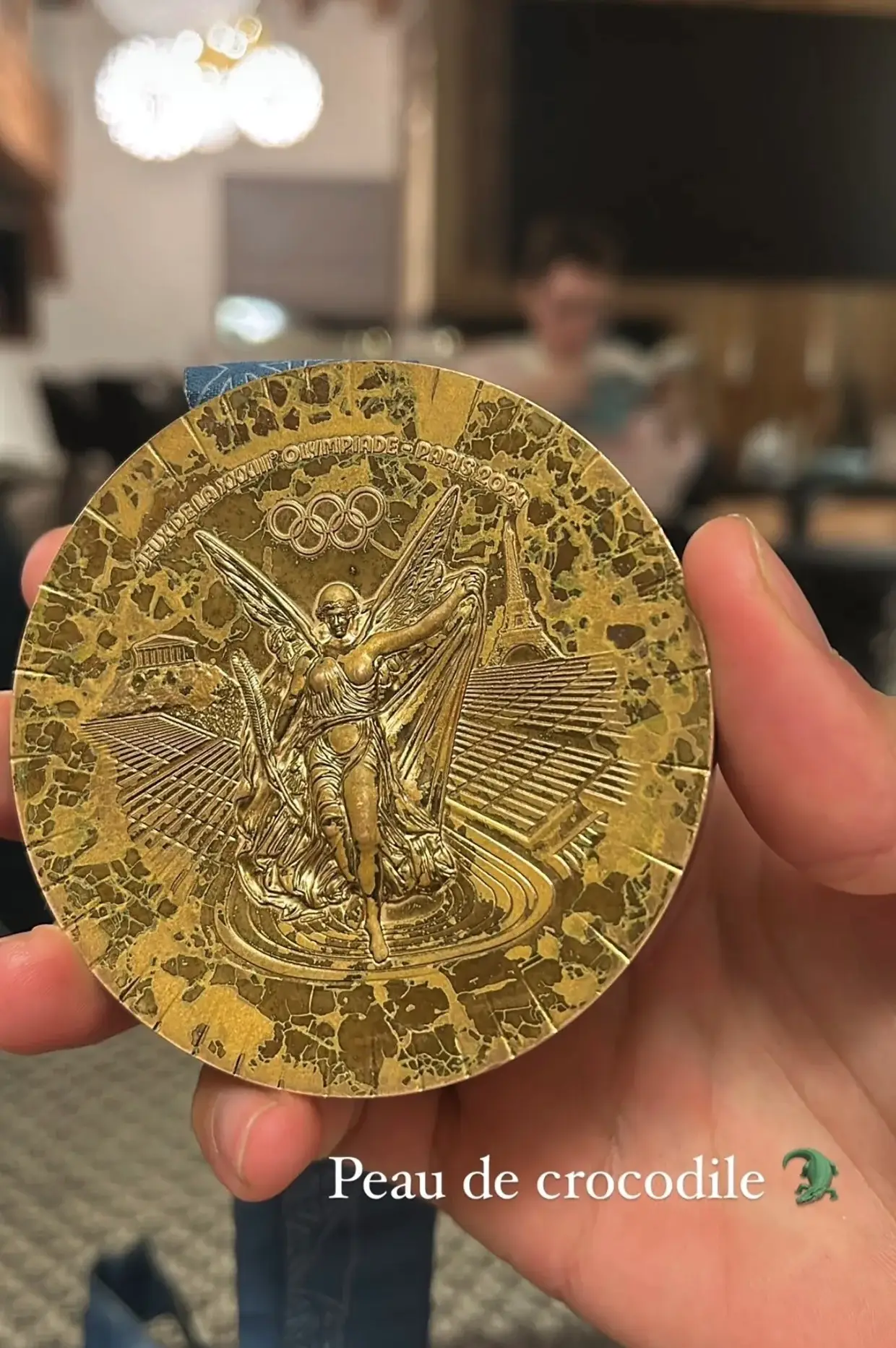 A French swimmer said his bronze medal looks as though it has 'crocodile skin' just six months after he got it (Instagram/@clem_secchi)