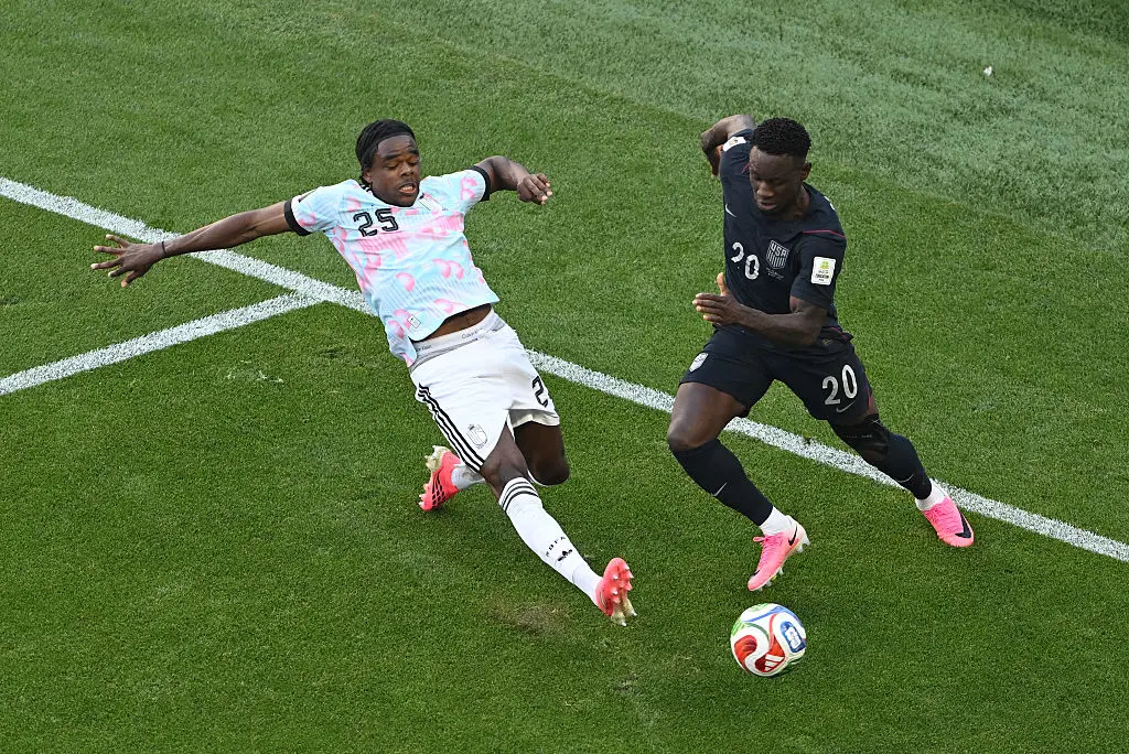 Folarin Balogun tackled by Belgium's Nathan Ngoy (David Ramos/Getty Images)