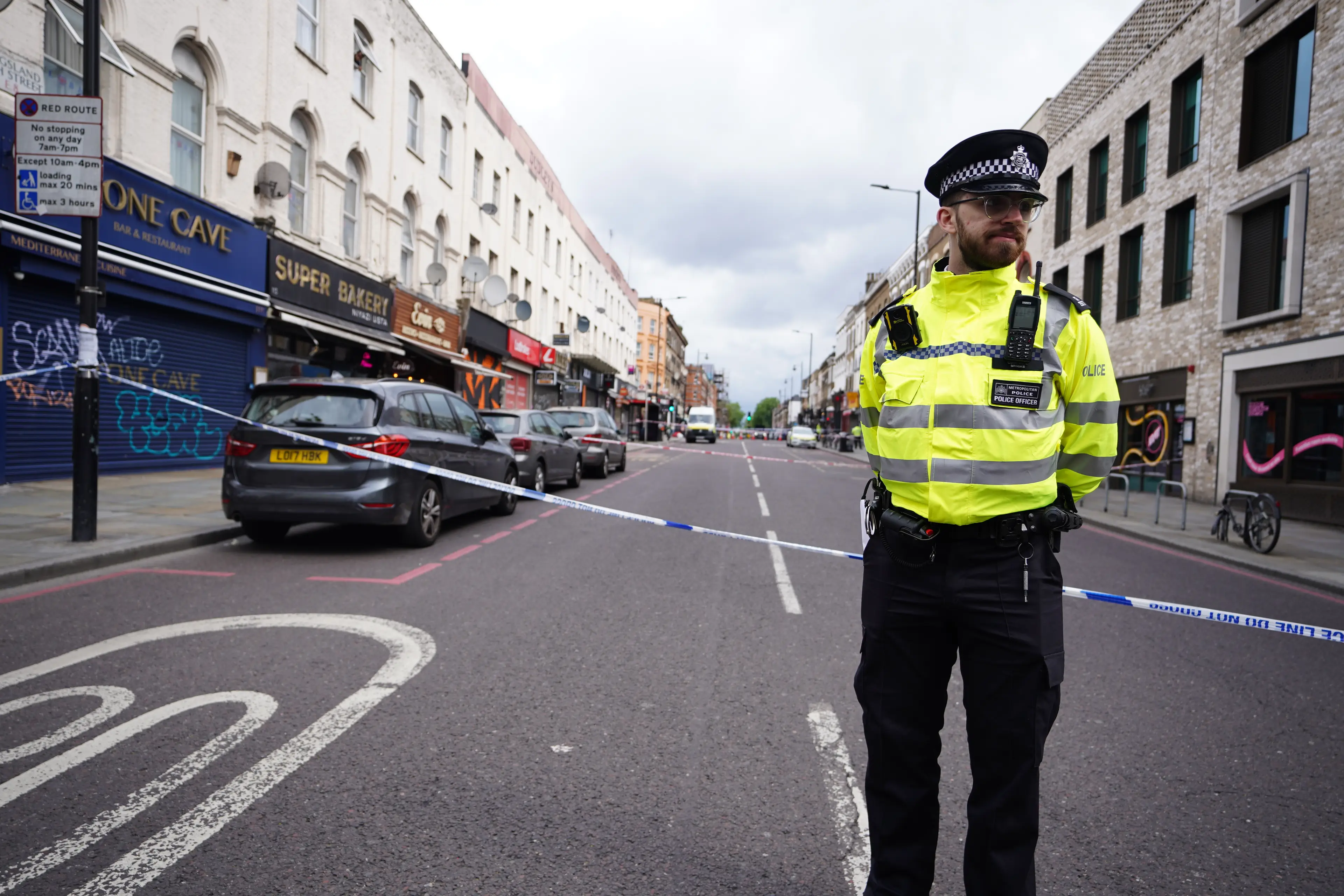 Police arrived at the scene in Kingsland High Street (PA)