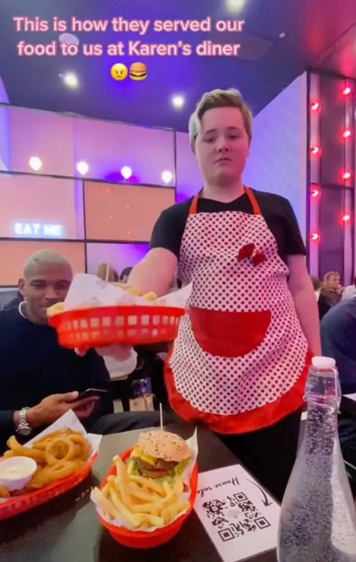 The member of staff could be seen touching and eating the food.