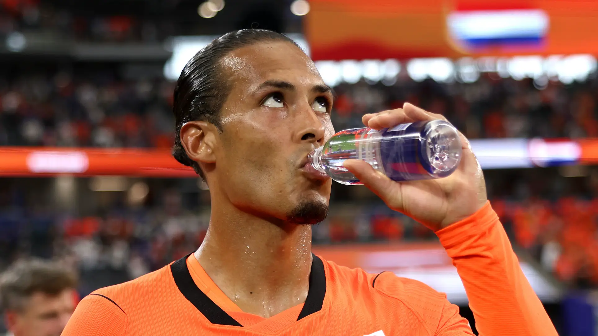 Van Dijk isn't a fan of the mandatory water breaks. (Photo by Maja Hitij - FIFA/FIFA via Getty Images)