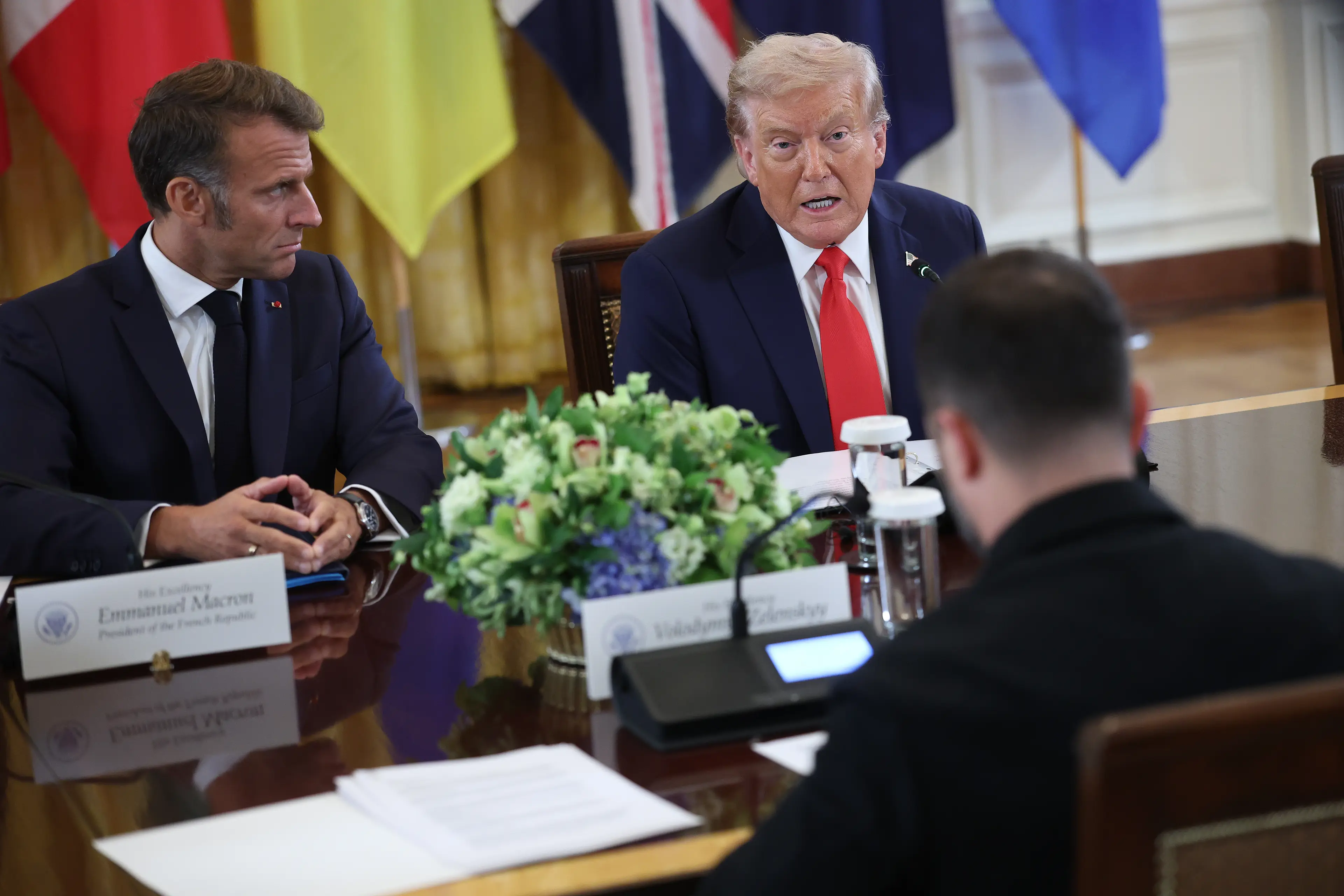 Trump was heard telling Emmanuel Macron he thinks Putin is ready to make a deal 'as crazy as it sounds' (Win McNamee/Getty Images)
