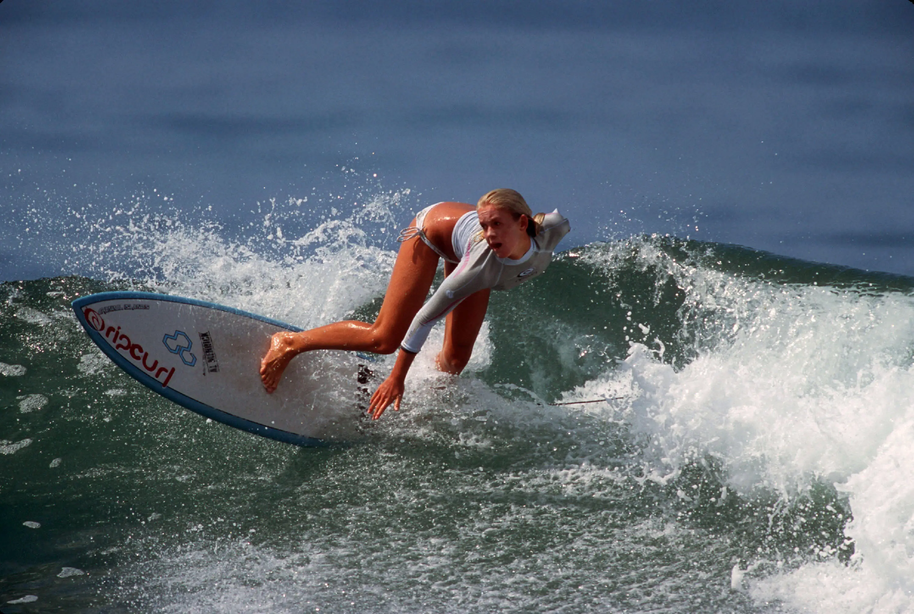 Hamilton surfing during a 2004 visit to California.