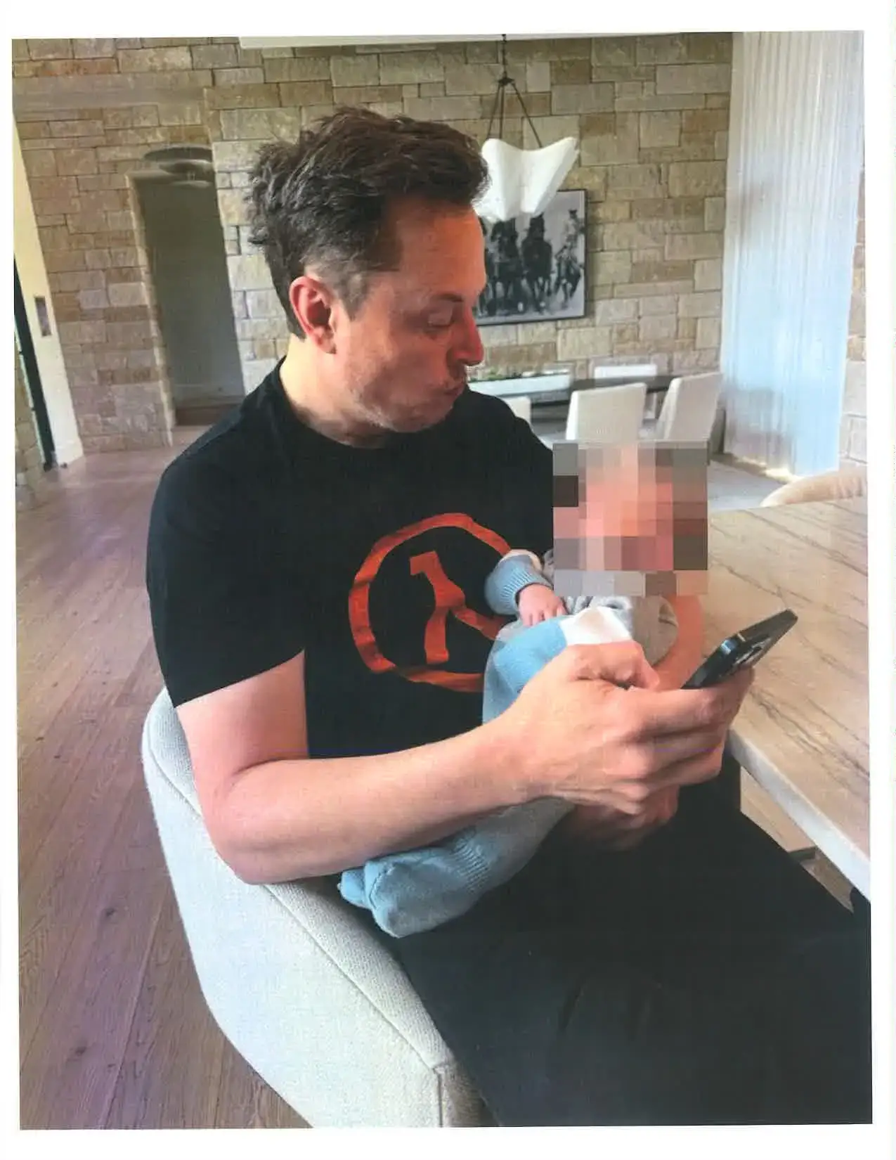 Elon Musk pictured holding his son with Ashley St Clair (New York State Court)
