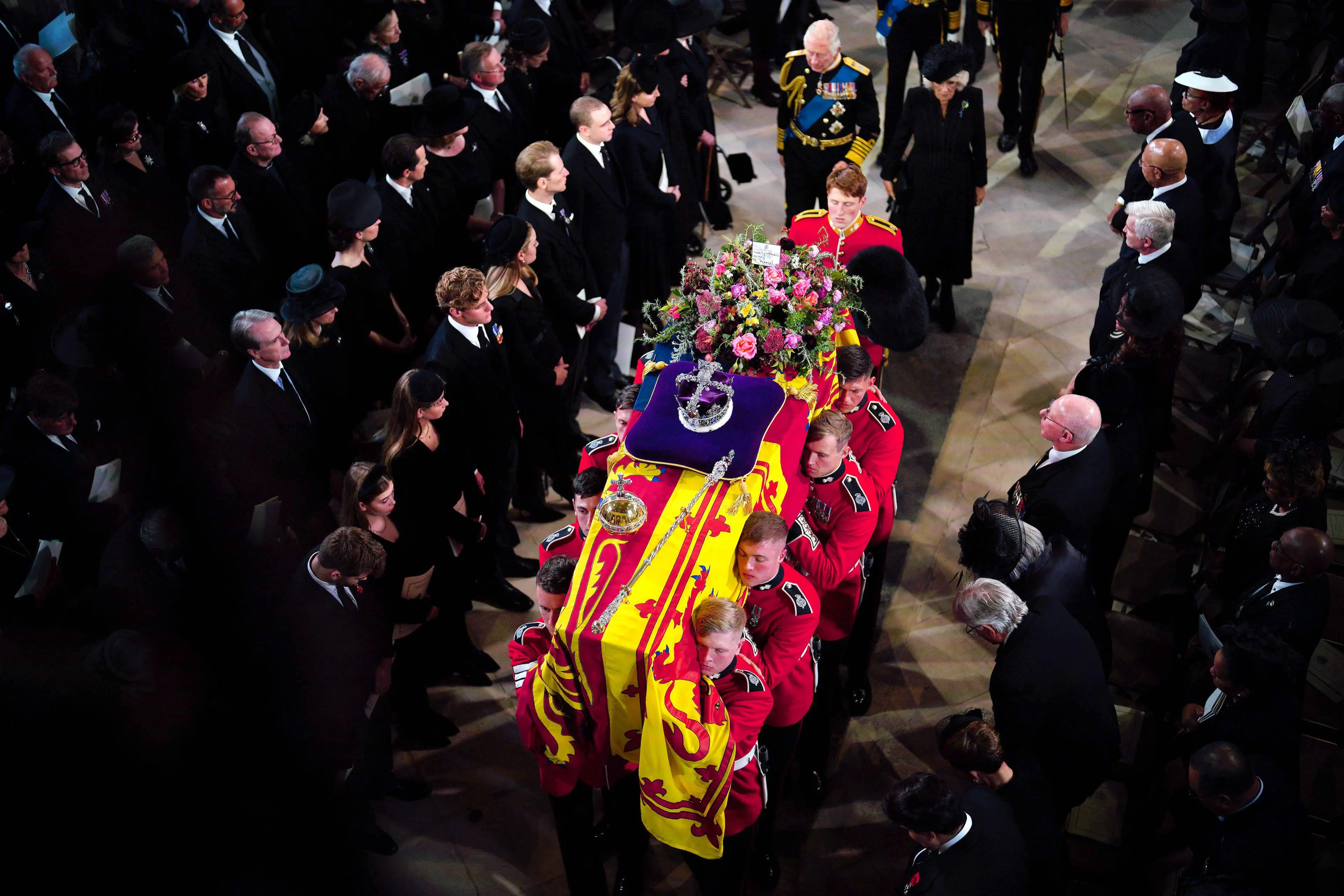 King Charles III at the casket of his mother, Queen Elizabeth II.