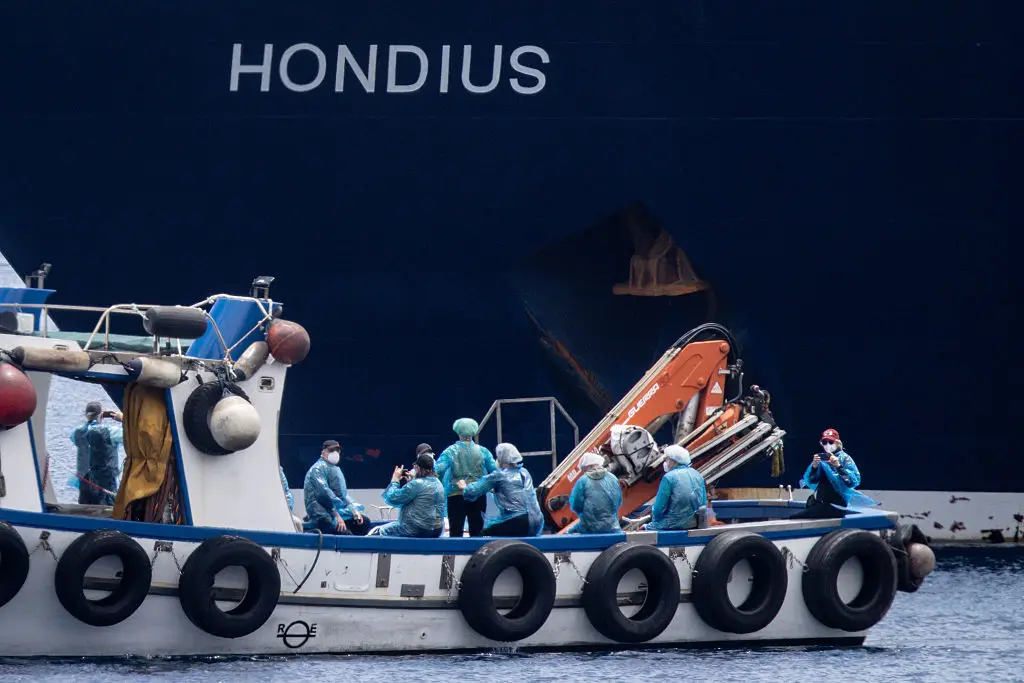 Passengers were given PPE to wear for the duration of the evacuation (Chris McGrath/Getty Images)