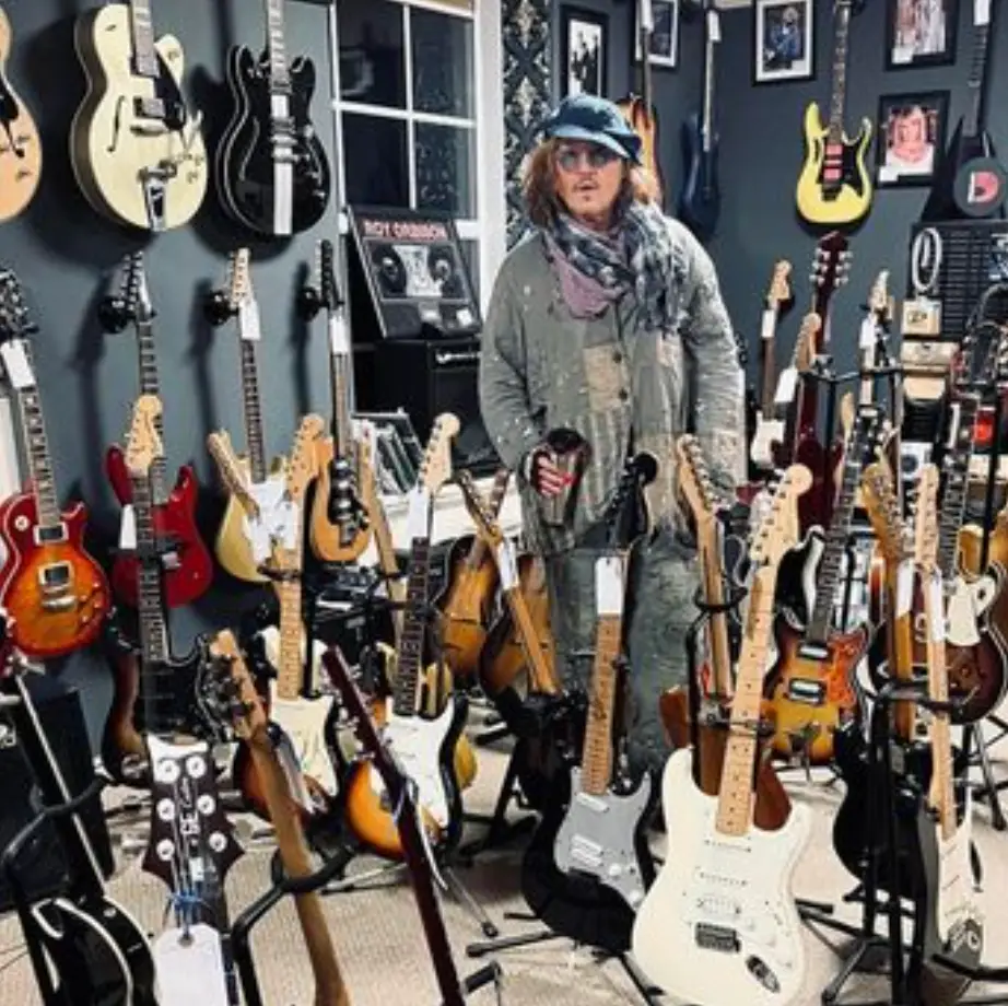 The Hollywood actor tried out several guitars.