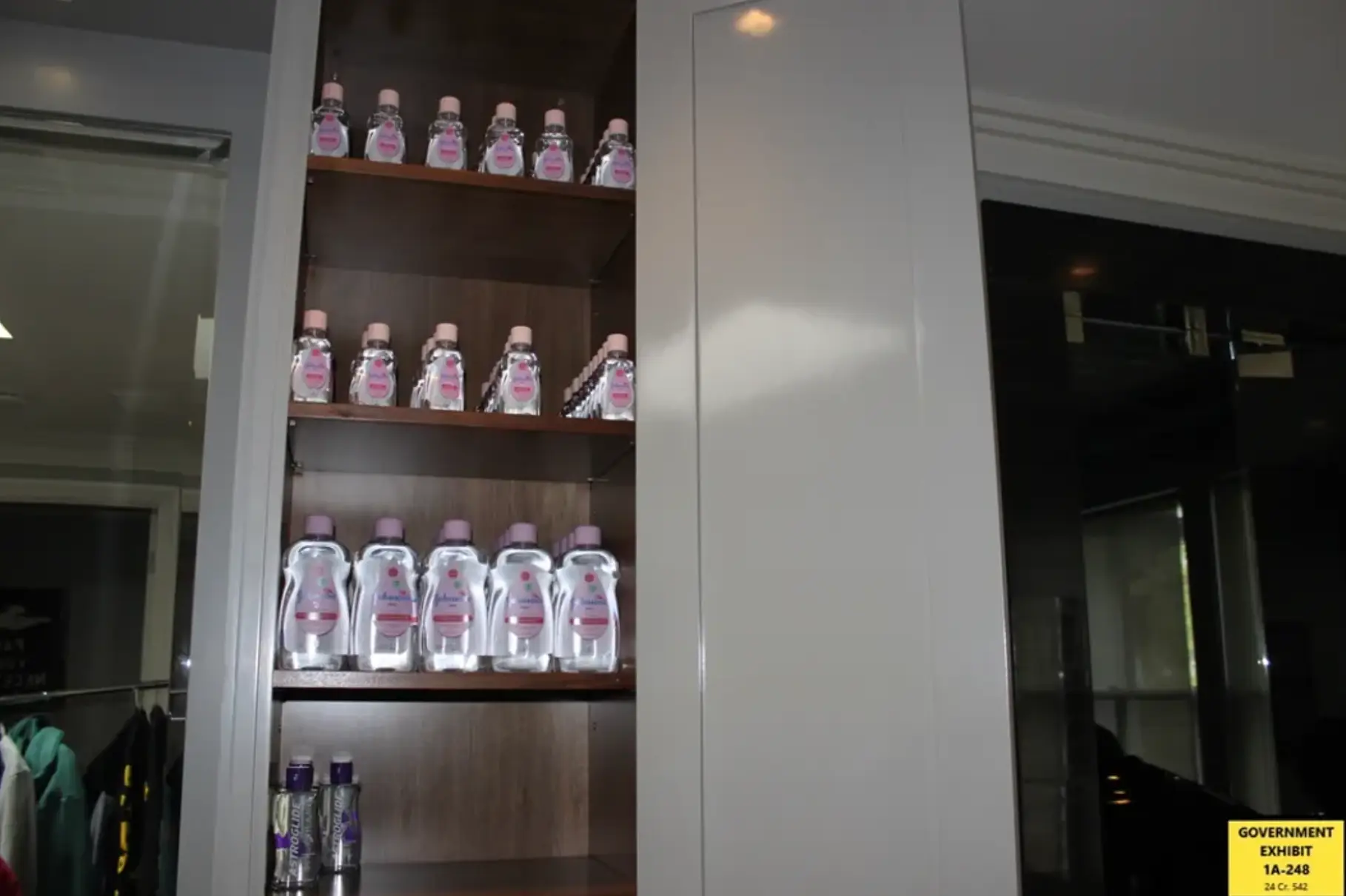 'Hundreds' of bottles of baby oil and lube were found (Department of Justice)