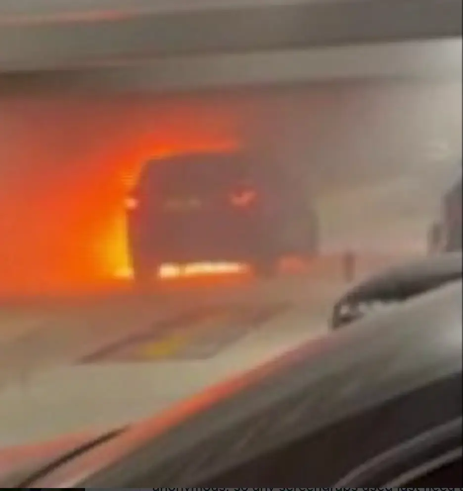 The car could be seen burning in the car park just moments before the explosion. 