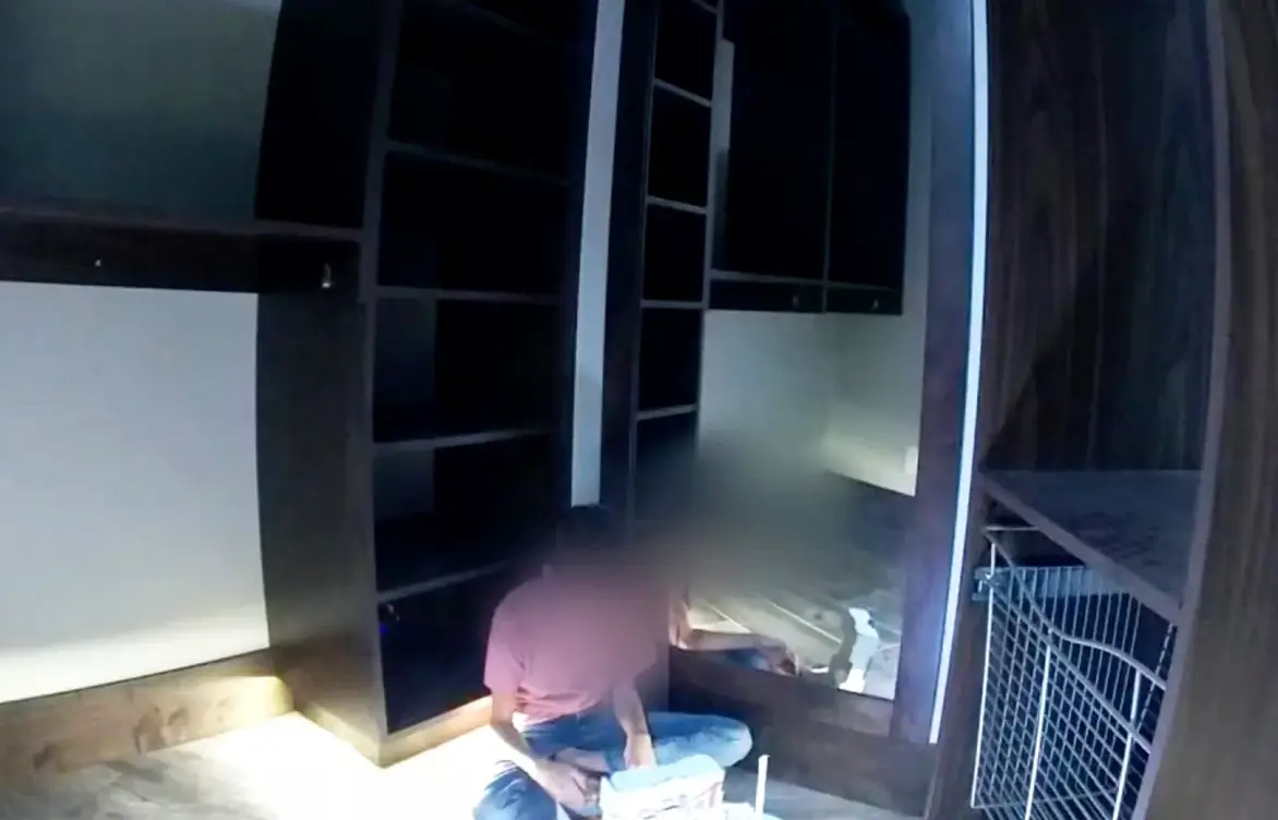 One of the Franke children being found by police in Hildebrandt's home (Washington County Attorney's Office)