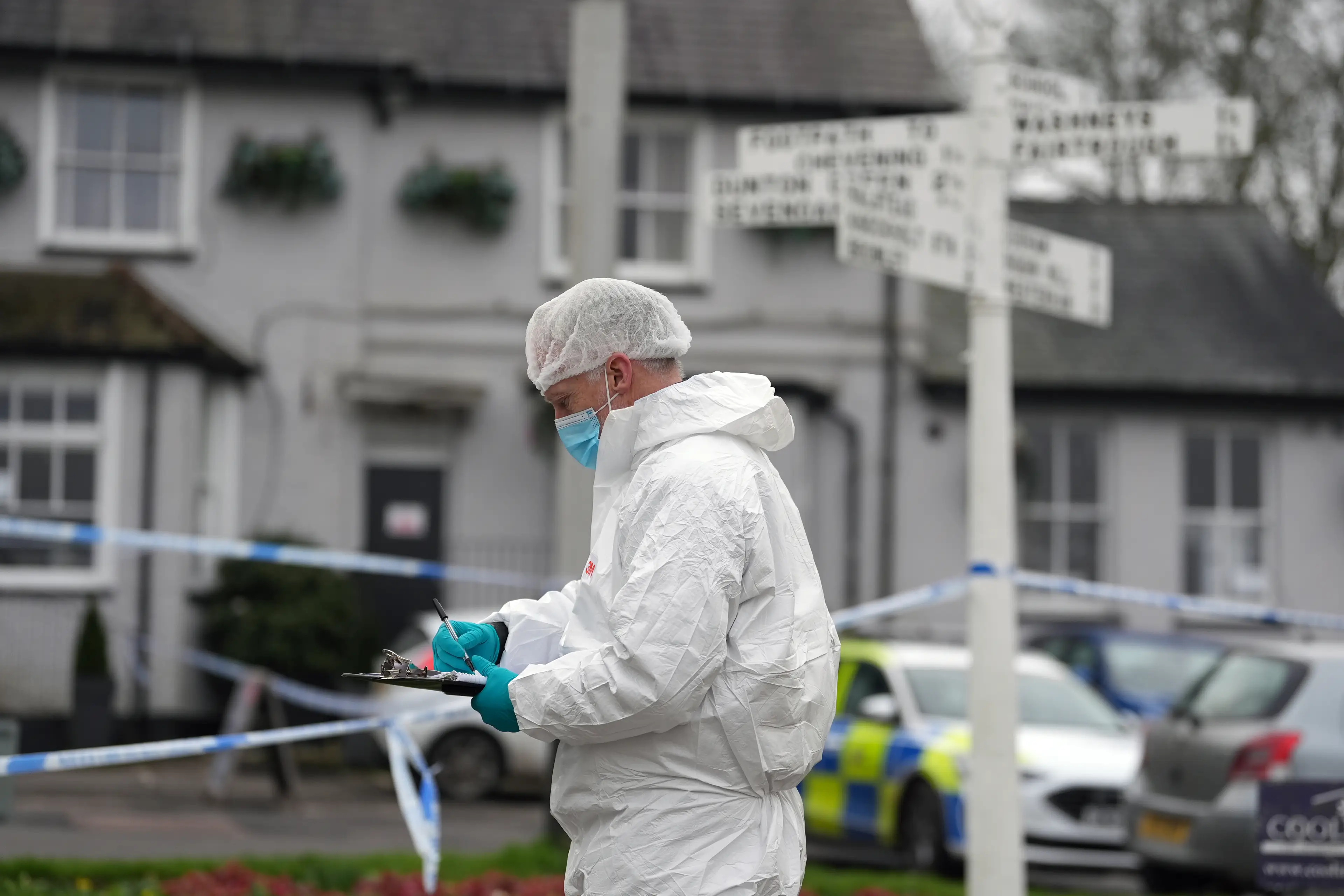 Forensics teams have been checking the pub, a male suspect is said to have fled the scene where the woman was shot dead (Gareth Fuller/PA Wire)
