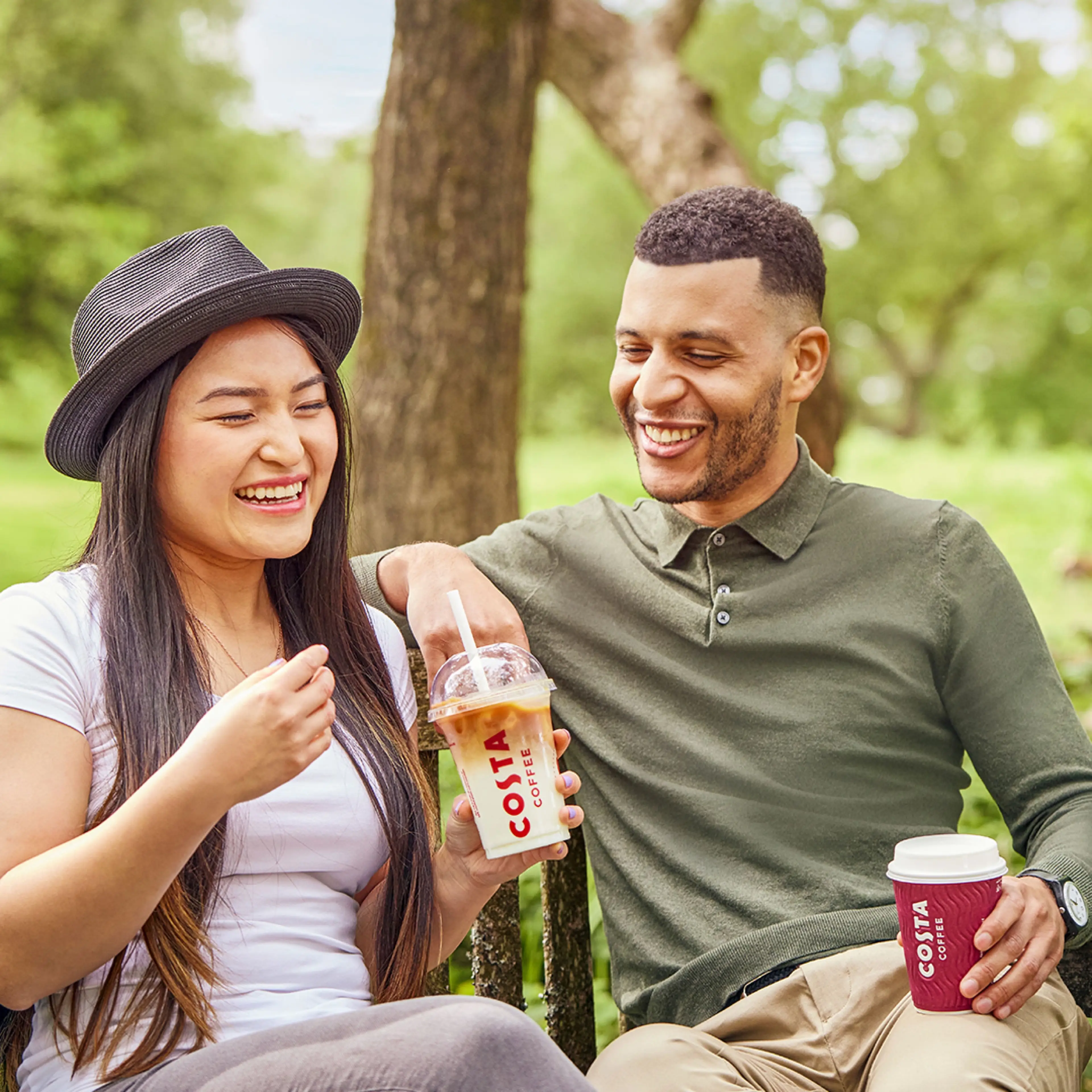 Couple drinking Costa coffee