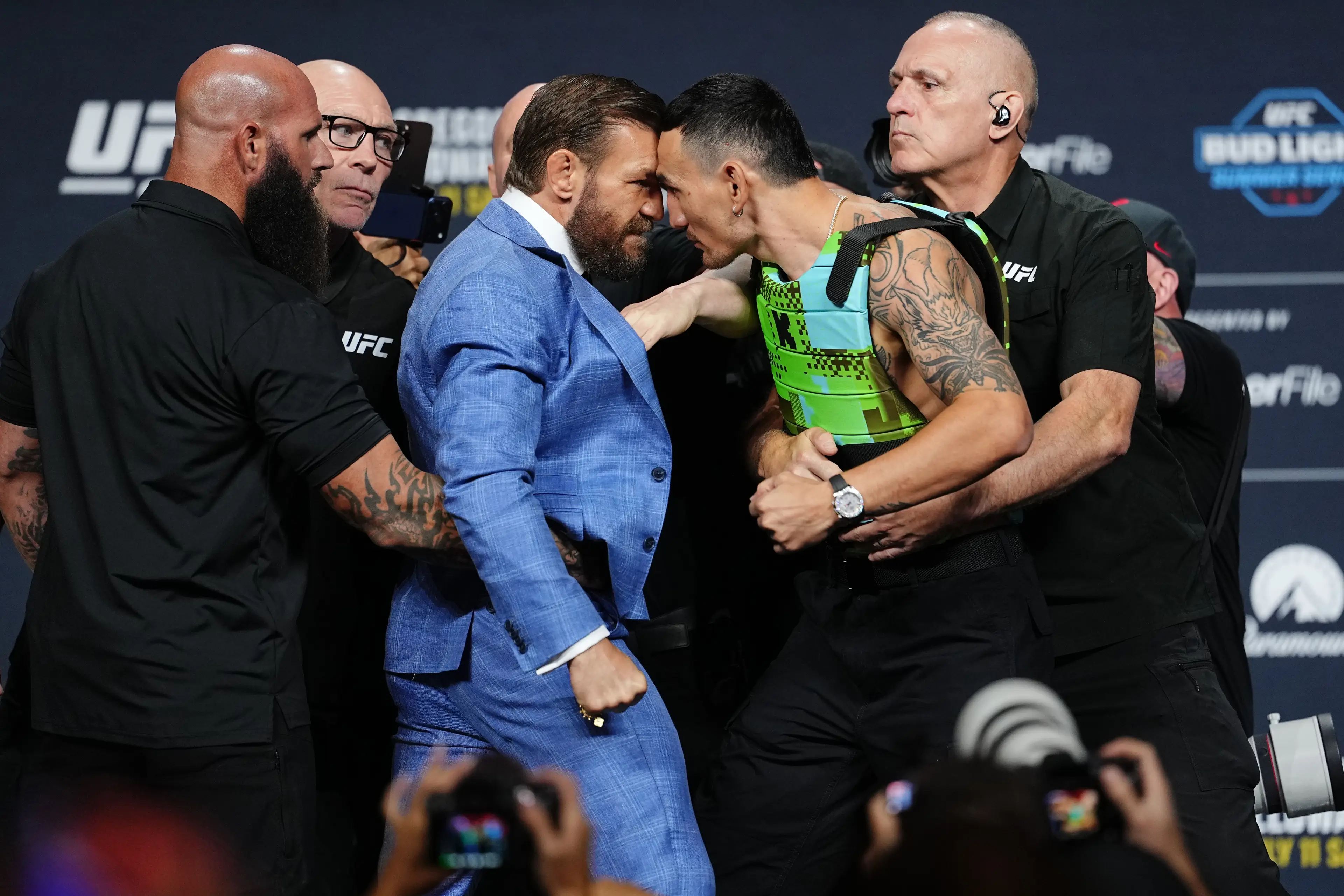 McGregor swiped the glasses before getting even closer. (Jeff Bottari/Zuffa LLC)