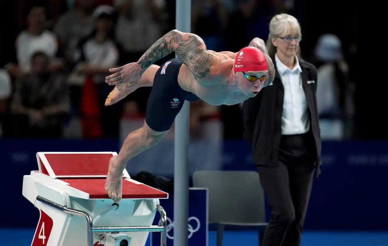 Peaty's son consoled him at the end of the race. (PA)