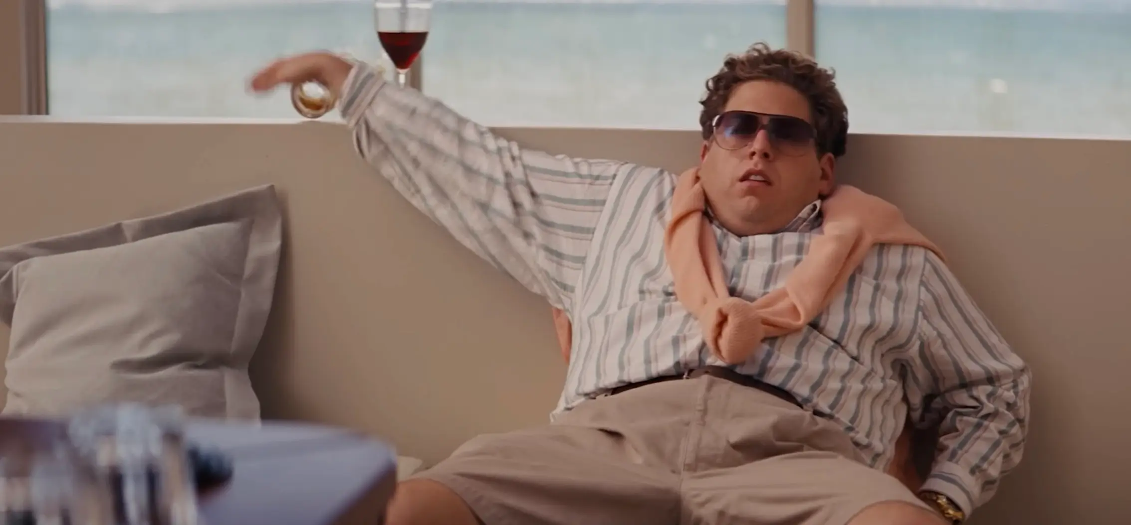 In one scene in The Wolf of Wall Street, Jonah Hill is seen knocking a glass off (Paramount Pictures)