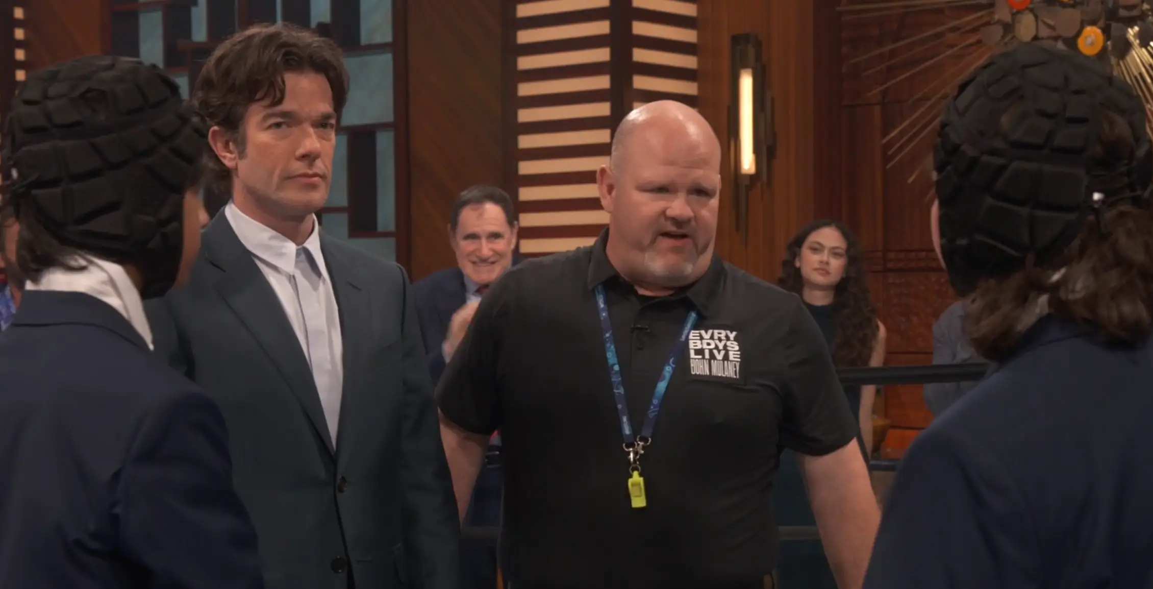 John Mulaney squaring up to fight three children (Netflix)