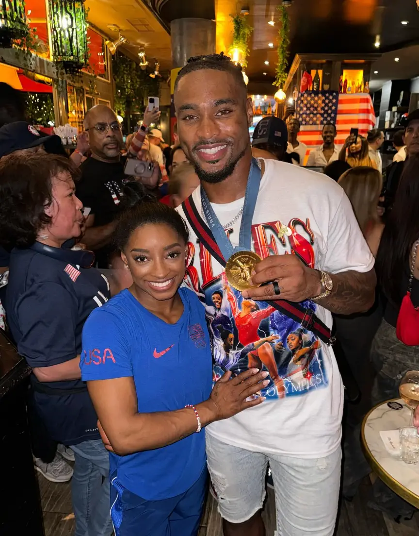 Fans of the star gymnast slammed Jonathan Owens for wearing his wife's gold medal. (Instagram/@jowens)