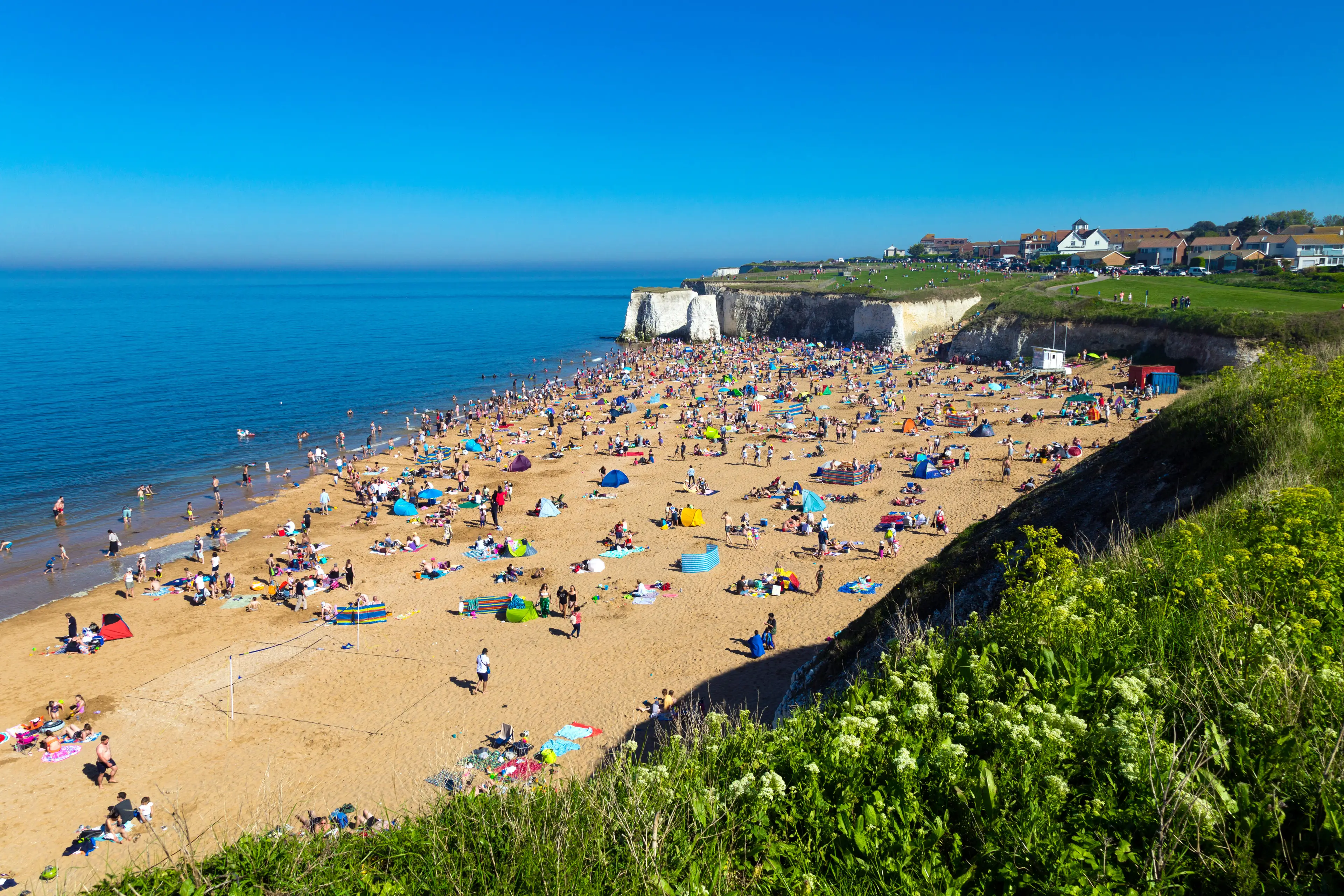 Beachgoers at Botany Bay, Kent.