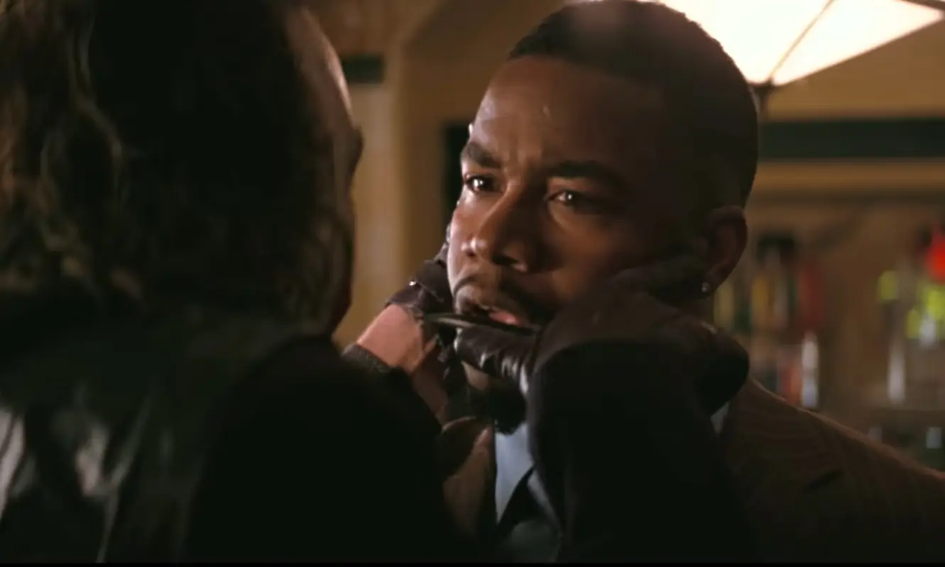 The Joker (Heath Ledger) decides to dispatch Gotham gangster Gambol (Michael Jai White) in The Dark Knight.