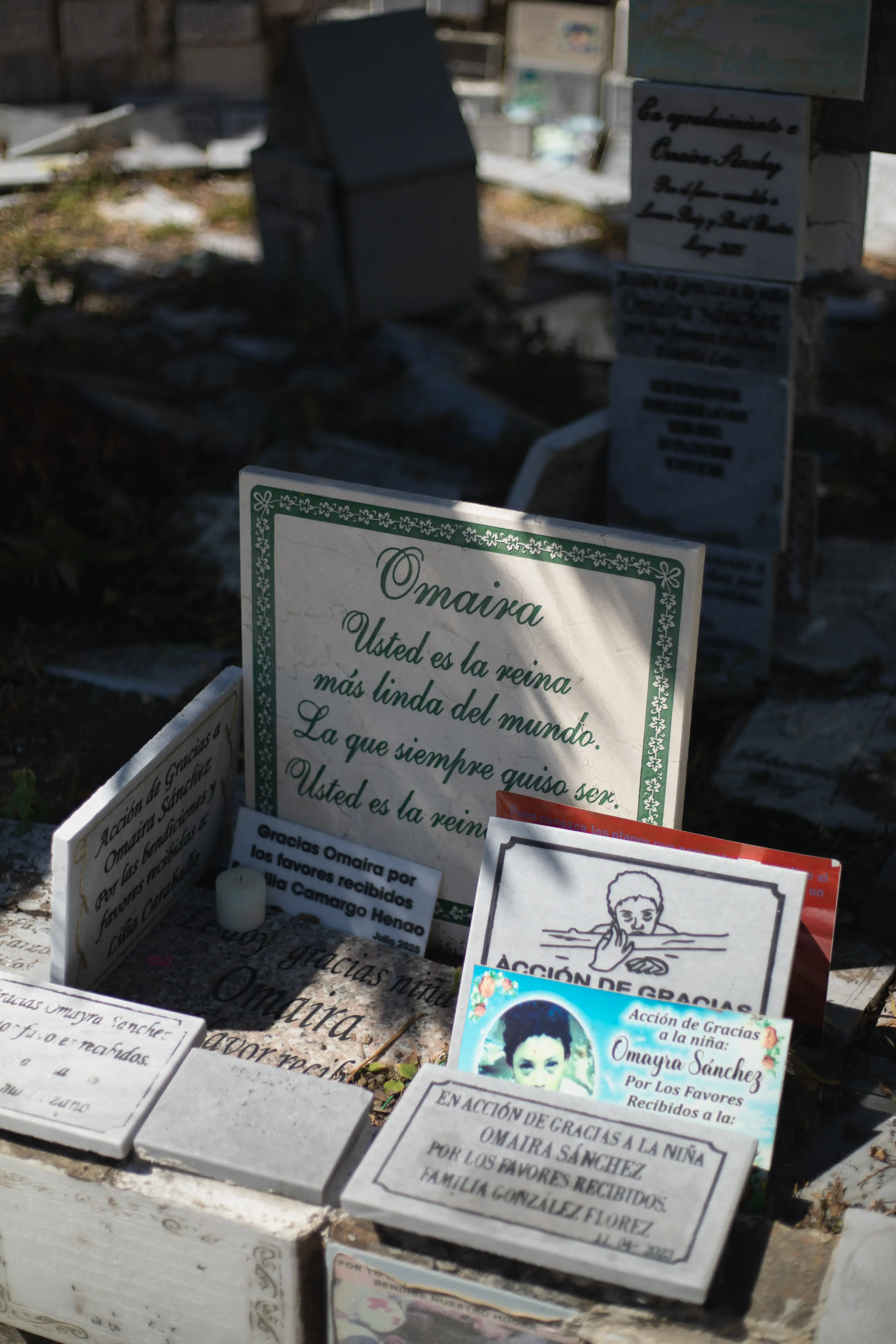 Plaques, angels, flowers and rosary beads are left in tribute to the girl. (Marie Audinet / Hans Lucas / AFP via Getty Images)