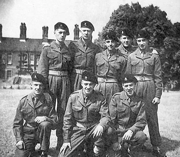 Sir Michael appears at the back, second on the left.