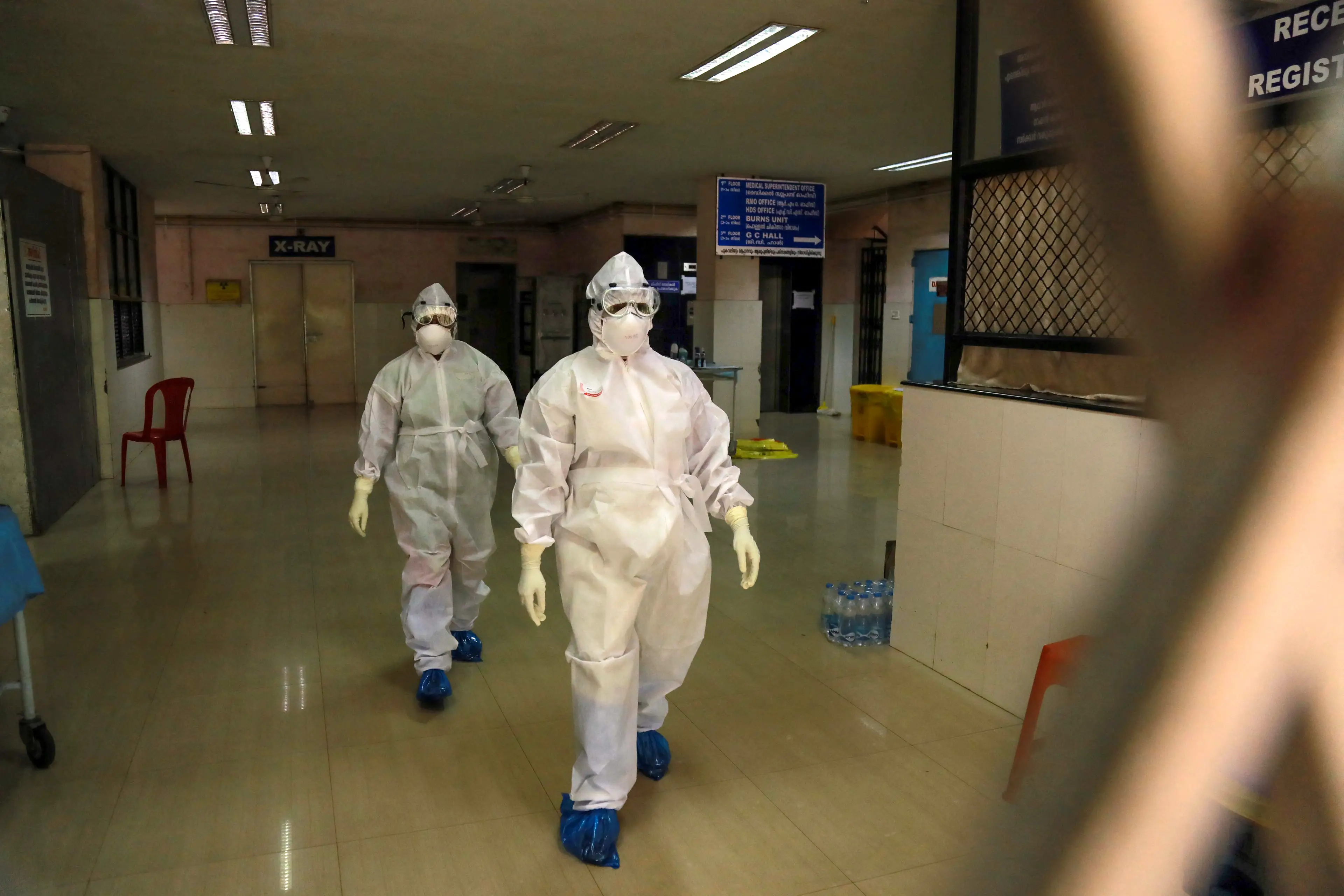 Indian health officials pictured in full protective gear during a 2019 outbreak in Kerala (STR/AFP via Getty Images)